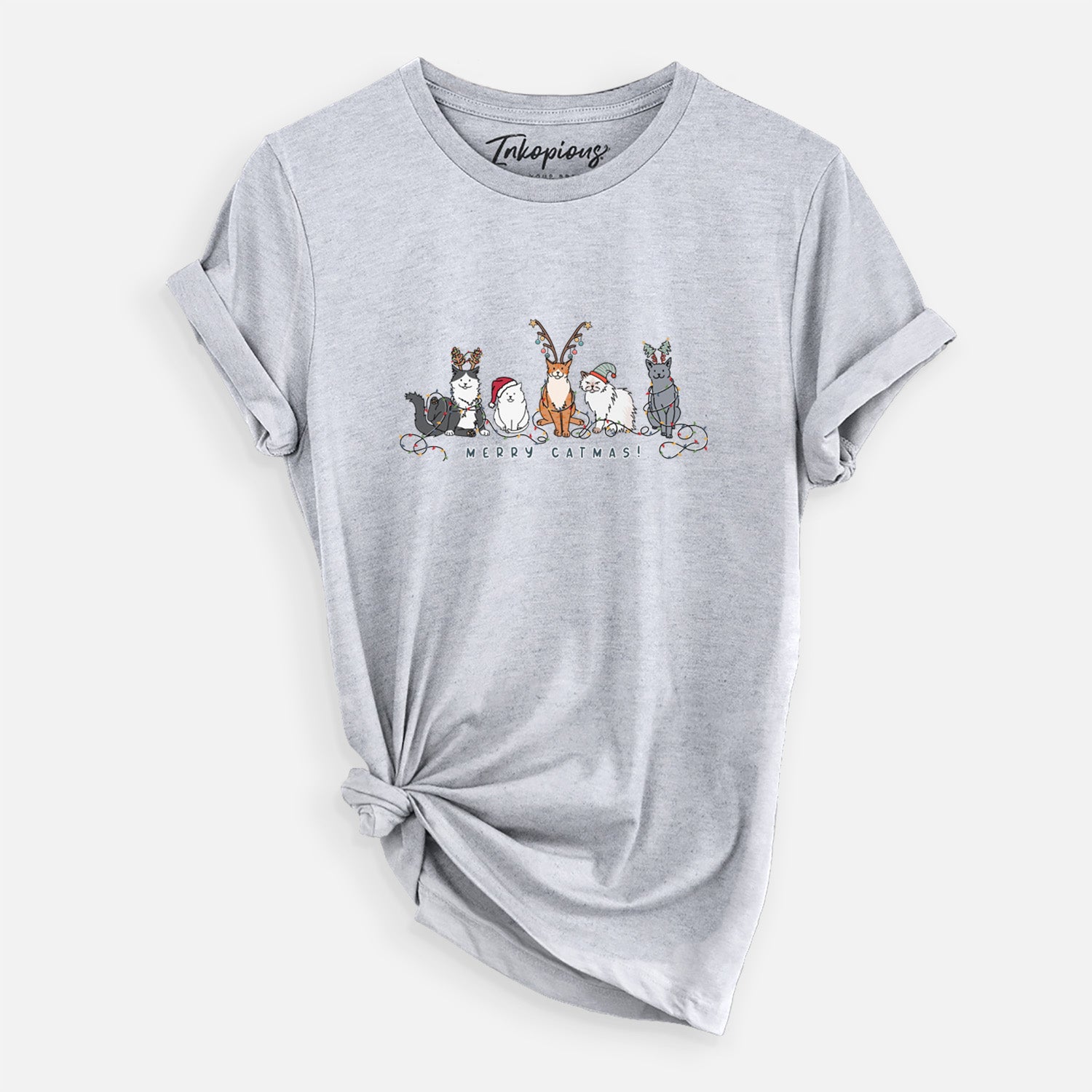 'Merry Catmas' design on a Grey Unisex crewneck, worn by a woman
