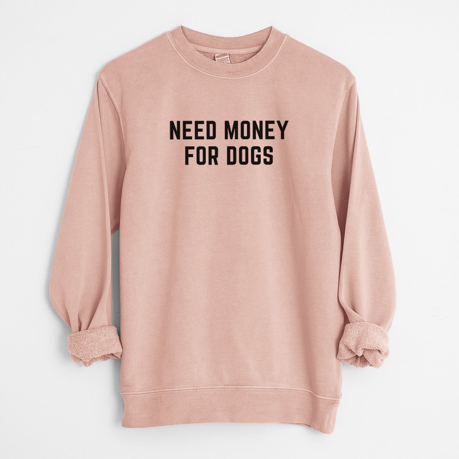 'Need Money for Dogs' design on a Dusty Pink Unisex pigment dyed crew sweatshirt