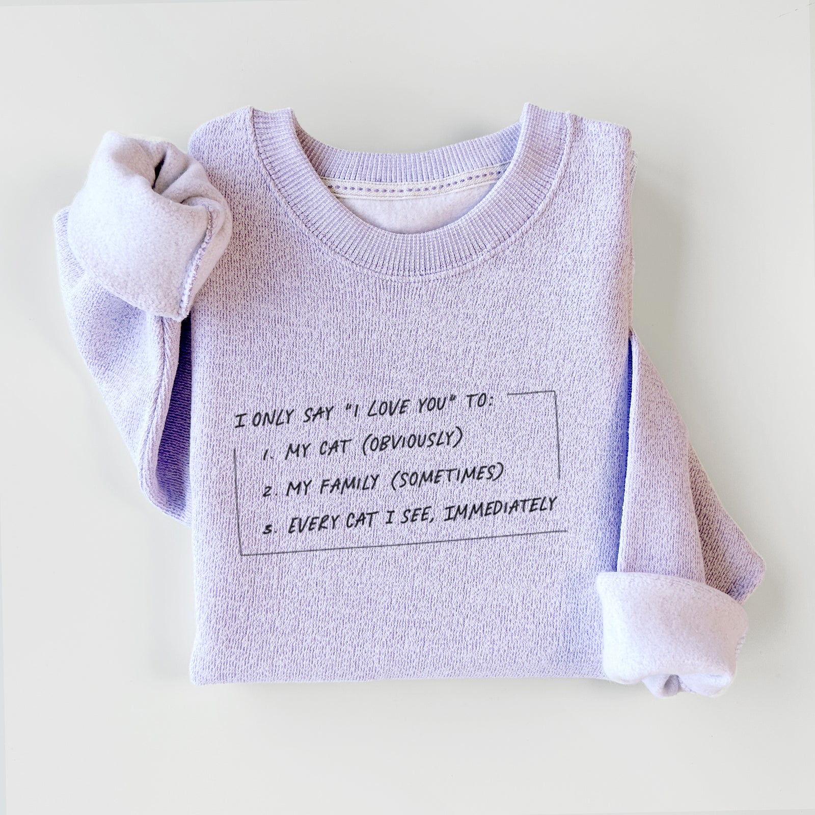 'I Only Say I Love You To - Cat' design on an Ice Purple knit sweatshirt