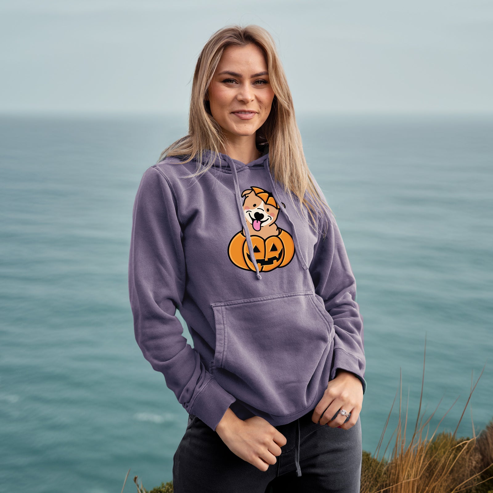 'Pumpkin Pup - Pitbull' design on a Plum Unisex pigment dyed hoodie, worn by a woman