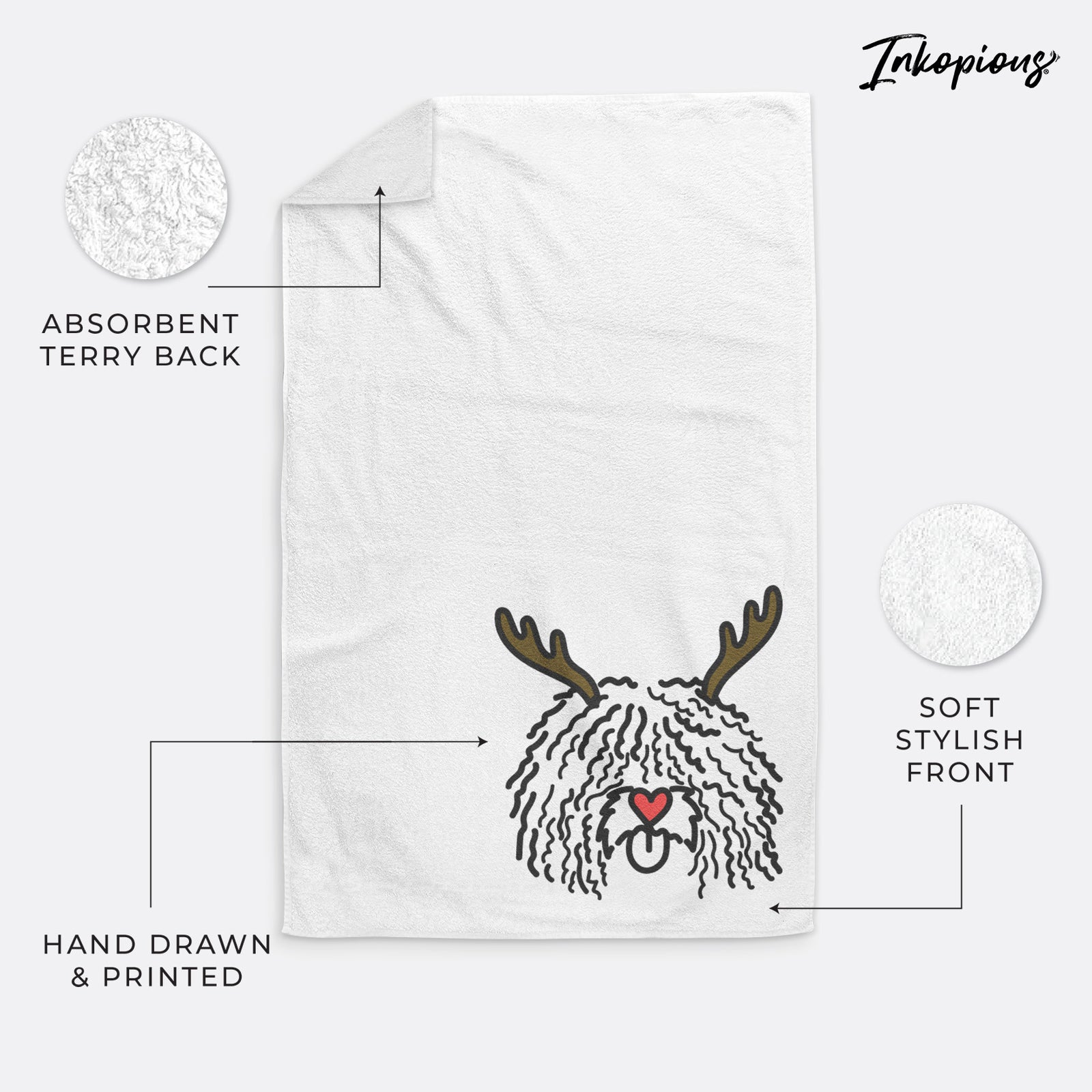 Minimalist line drawing of Alba the Spanish Water Dog with reindeer antlers and a red nose on a decorative hand towel