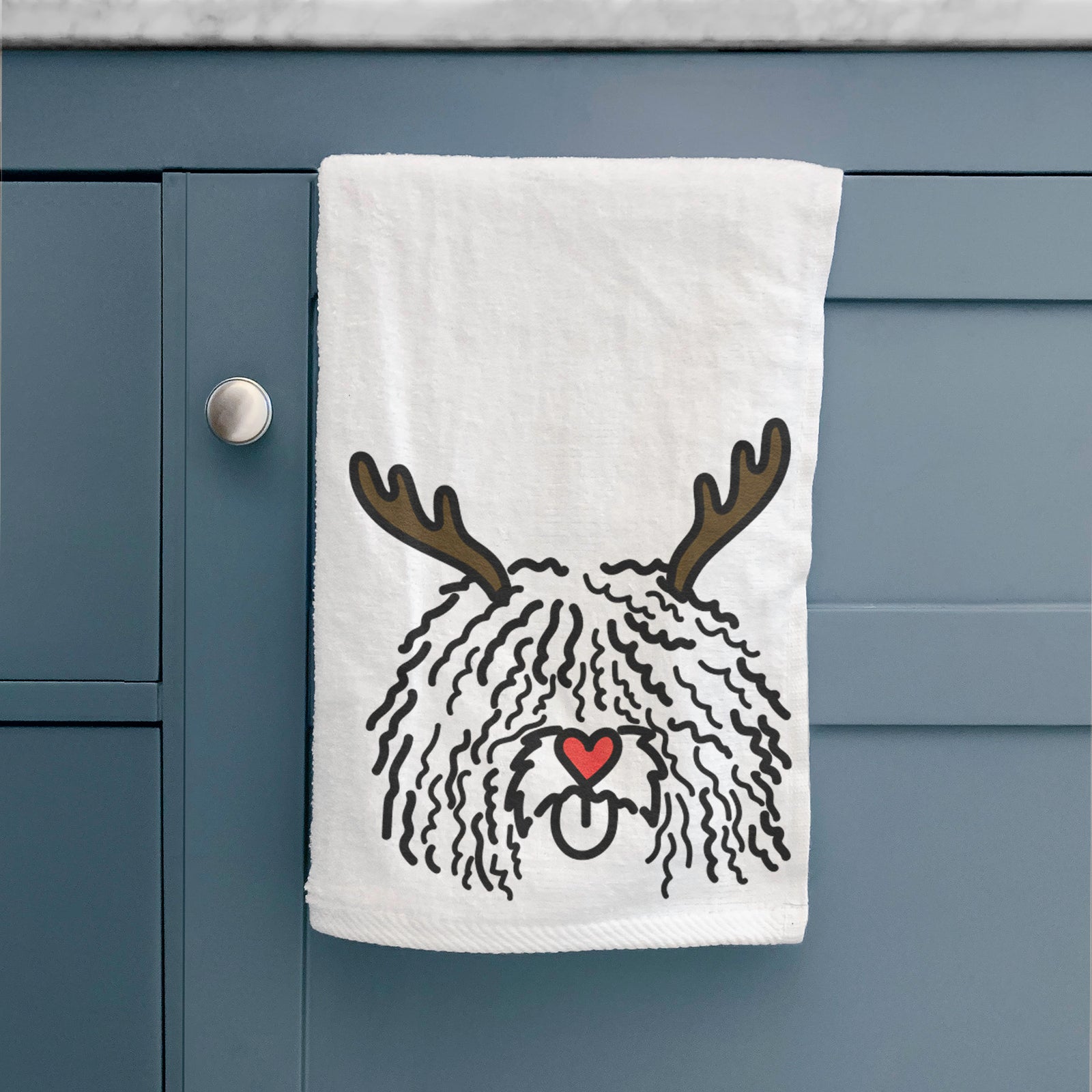 Minimalist line drawing of Alba the Spanish Water Dog with reindeer antlers and a red nose on a decorative hand towel