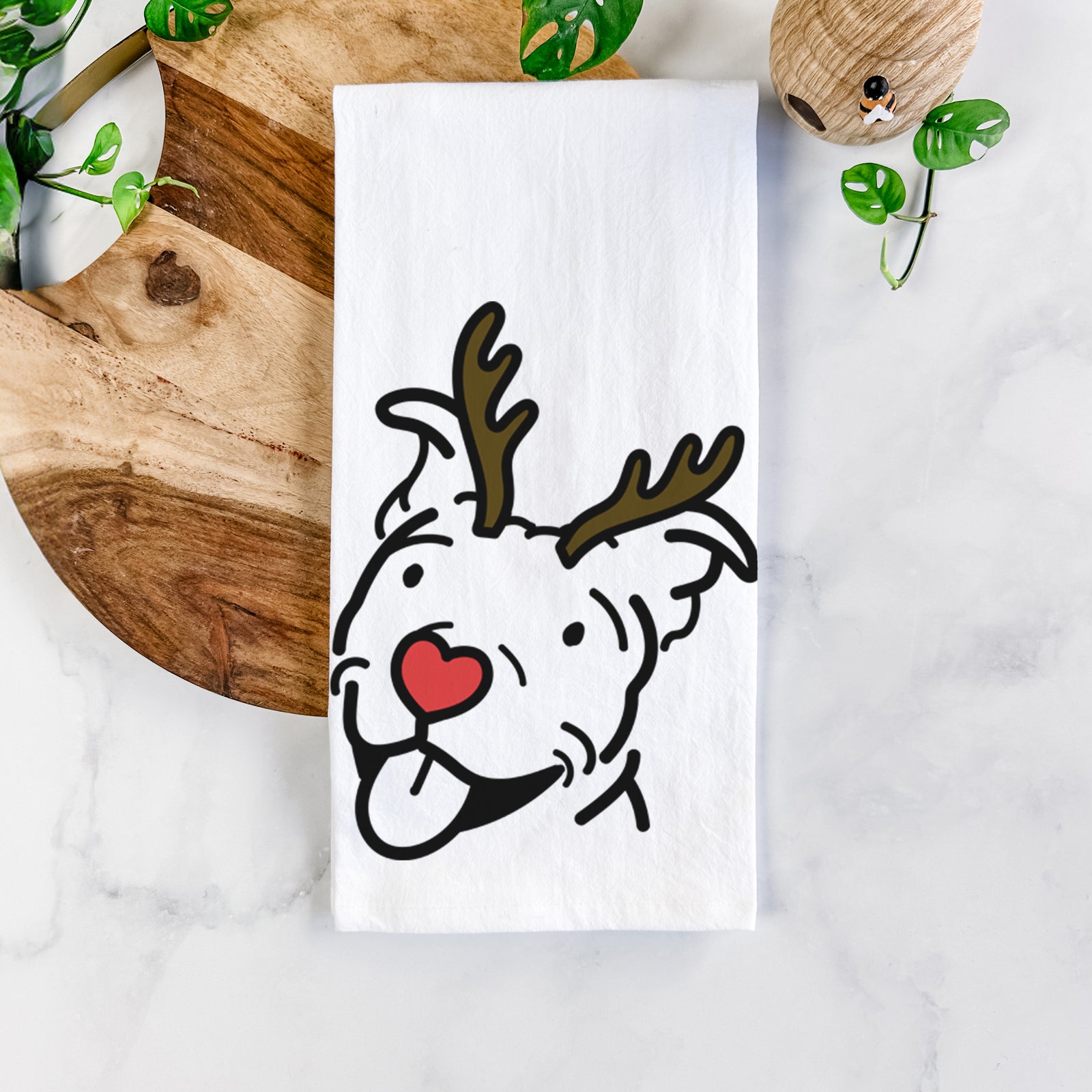 Minimalist line drawing of Arlo the Pitbull with reindeer antlers and a red nose on a tea towel