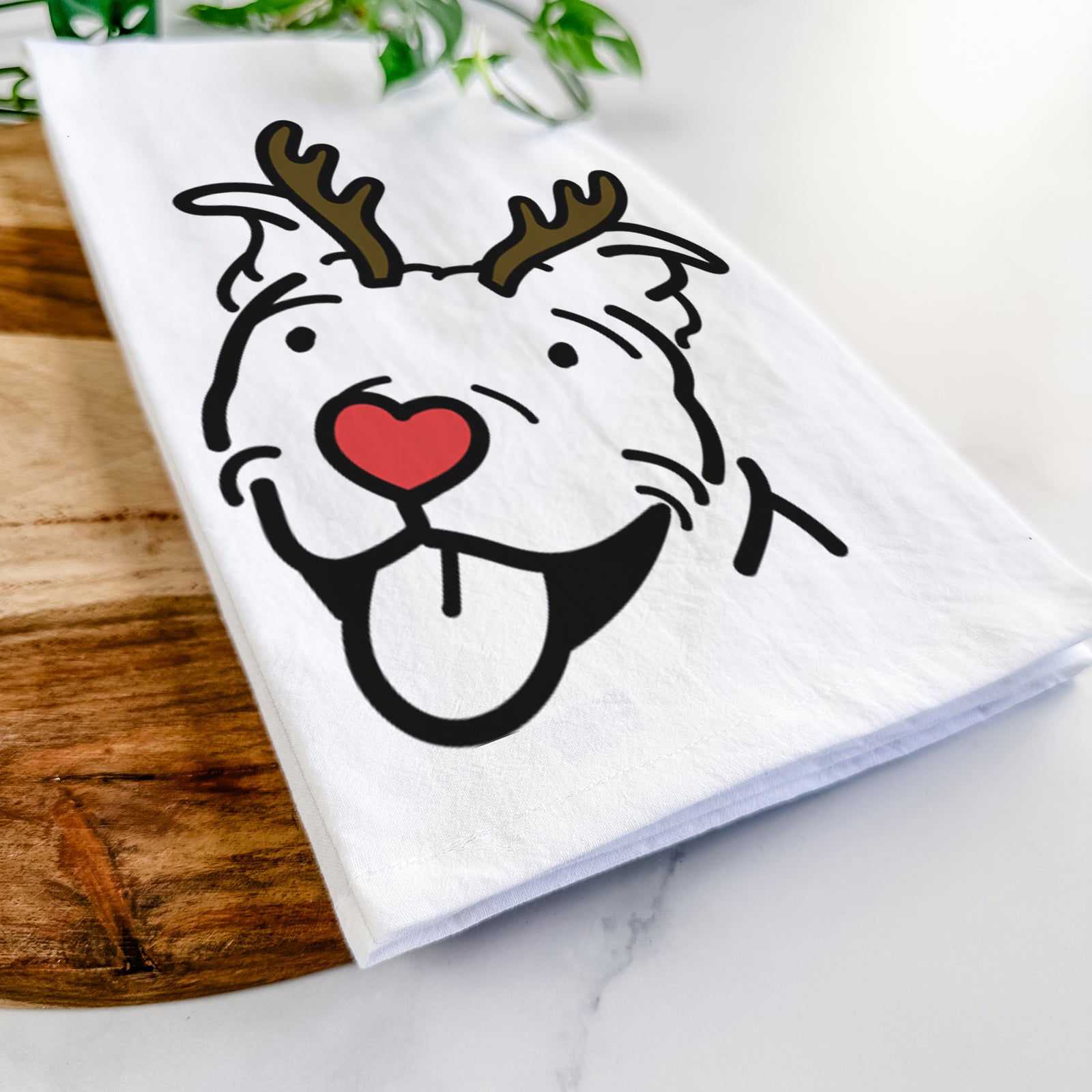 Minimalist line drawing of Arlo the Pitbull with reindeer antlers and a red nose on a tea towel