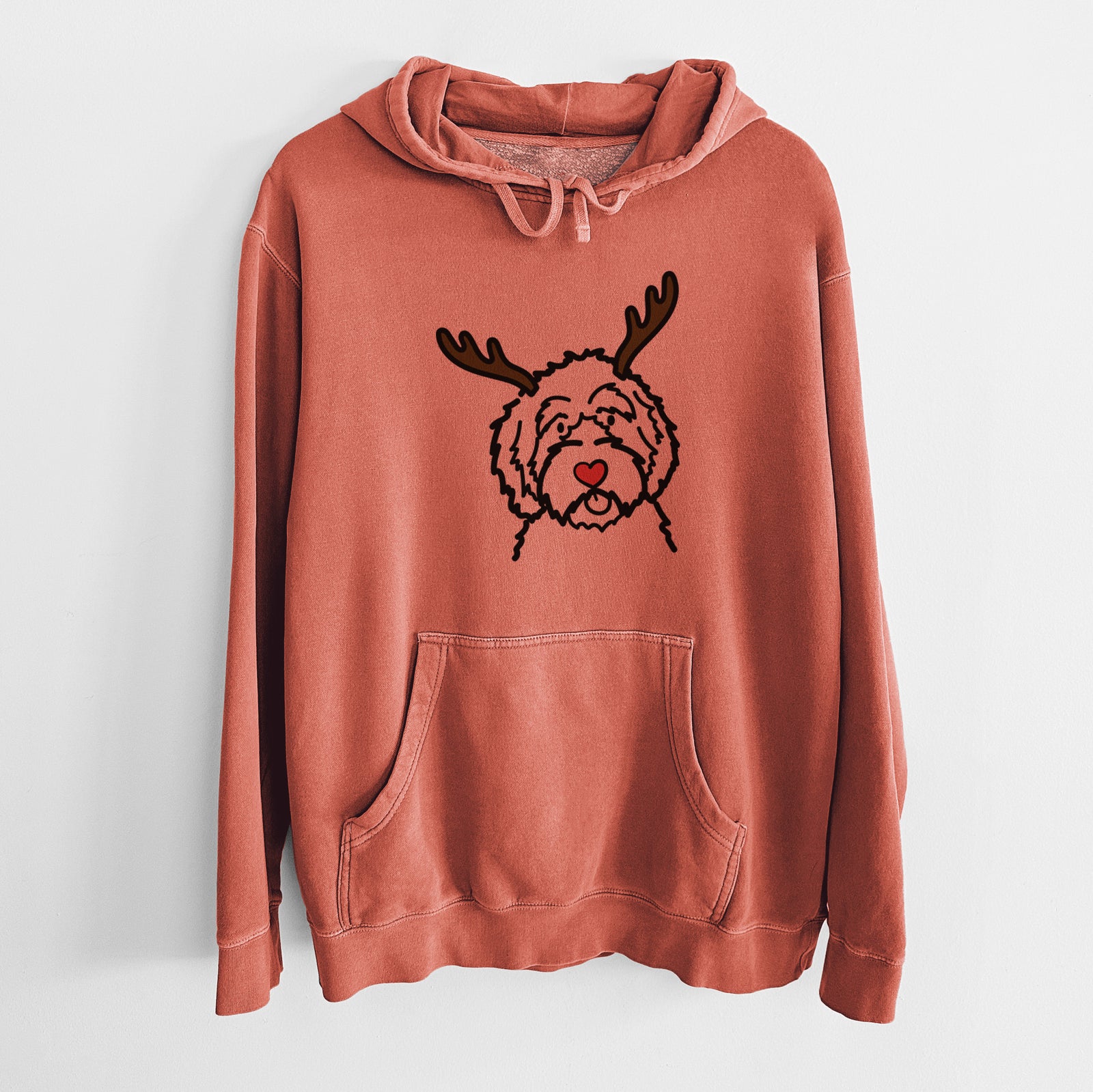 Minimalist line drawing of an Aussiedoodle with reindeer antlers and a red nose on an Amber Unisex pigment dyed hoodie