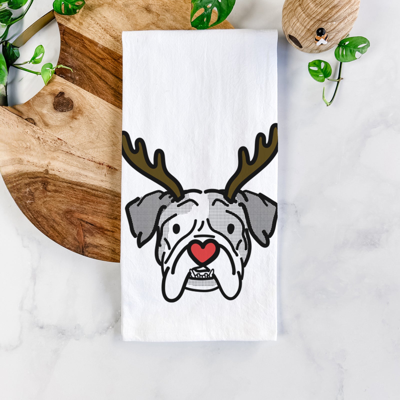 Minimalist line drawing of Bailey the English Bulldog with reindeer antlers and a red nose on a tea towel