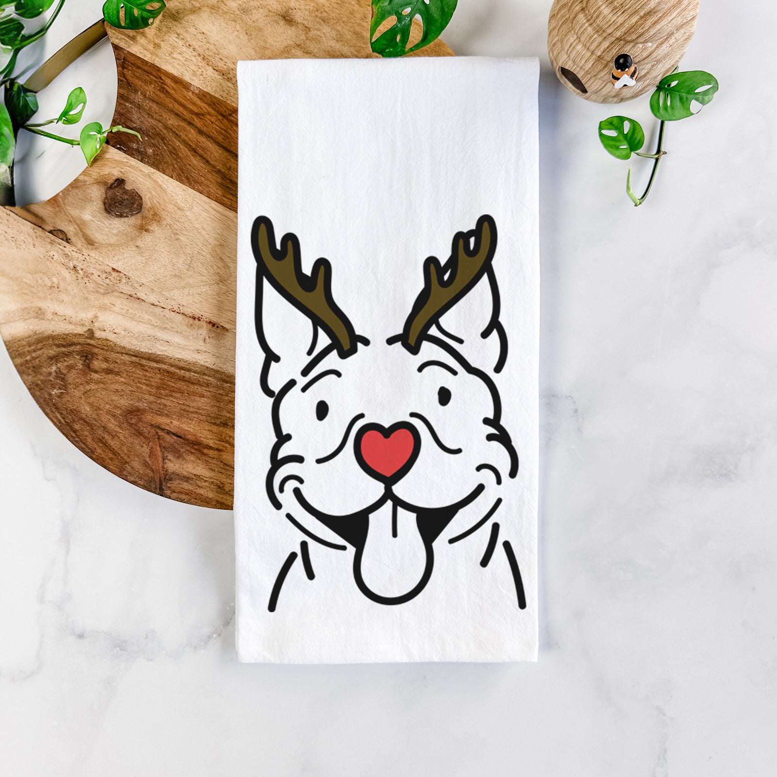 Minimalist line drawing of Basil the Pitbull with reindeer antlers and a red nose on a tea towel