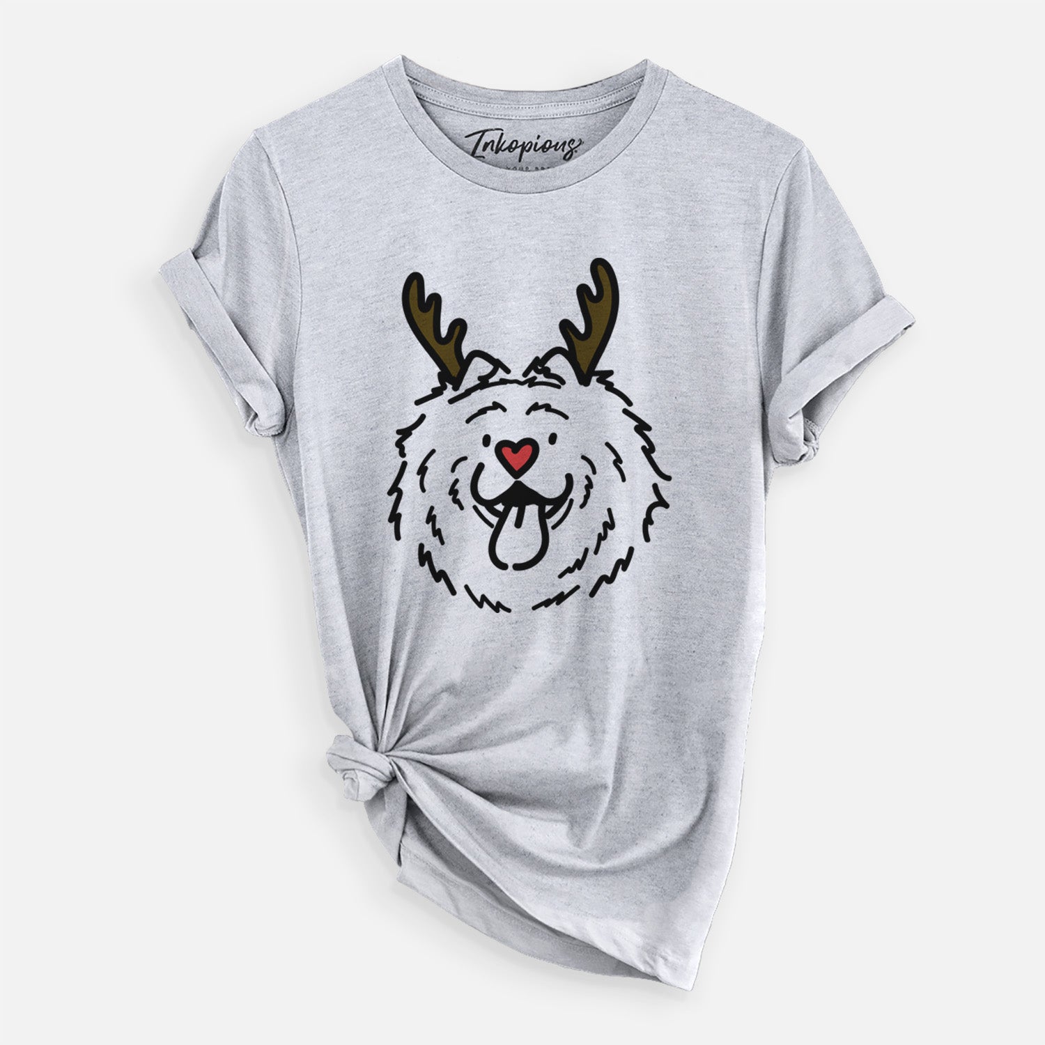 Minimalist line drawing of Bear the Chow Chow with reindeer antlers and a red nose on a Grey Unisex crewneck, worn by a woman