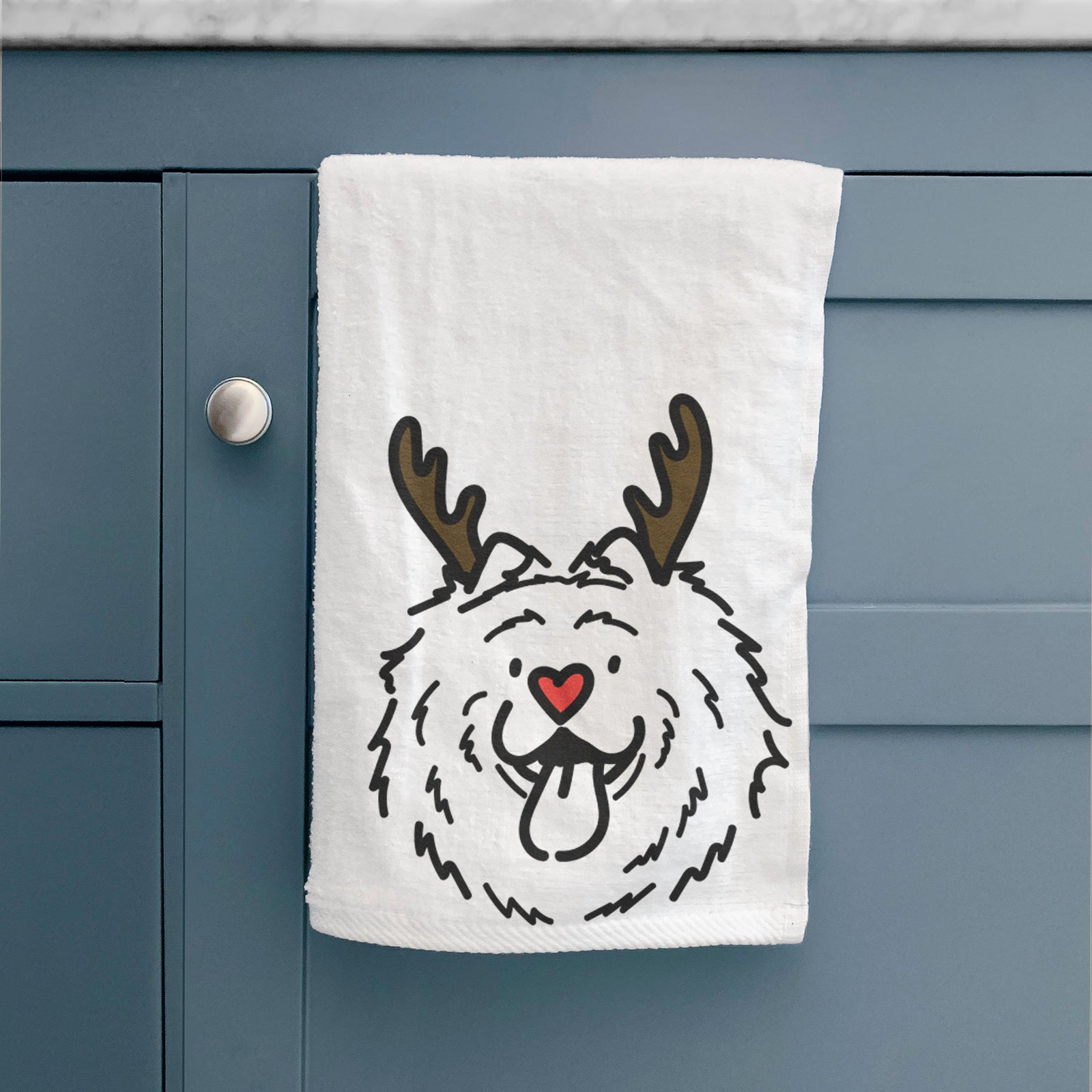 Minimalist line drawing of Bear the Chow Chow with reindeer antlers and a red nose on a hand towel