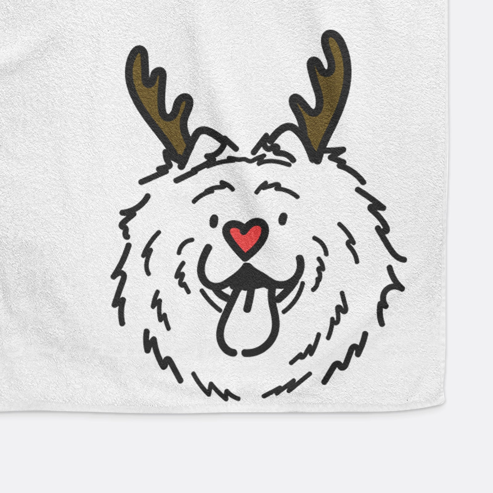 Minimalist line drawing of Bear the Chow Chow with reindeer antlers and a red nose on a hand towel