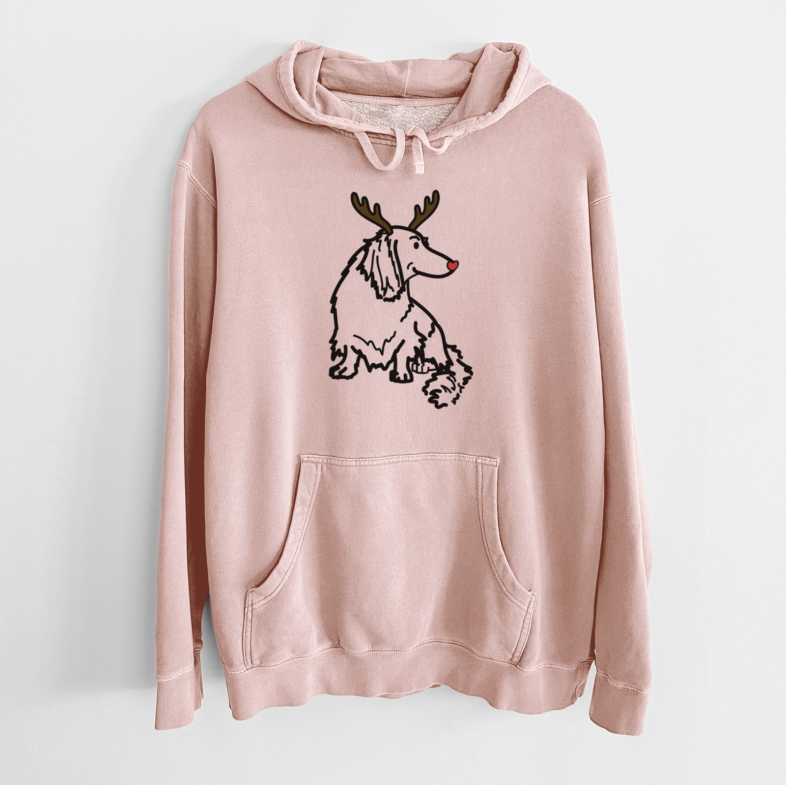 Minimalist line drawing of Bella the Dachshund with reindeer antlers and a red nose on a Dusty Pink Unisex pigment dyed hoodie