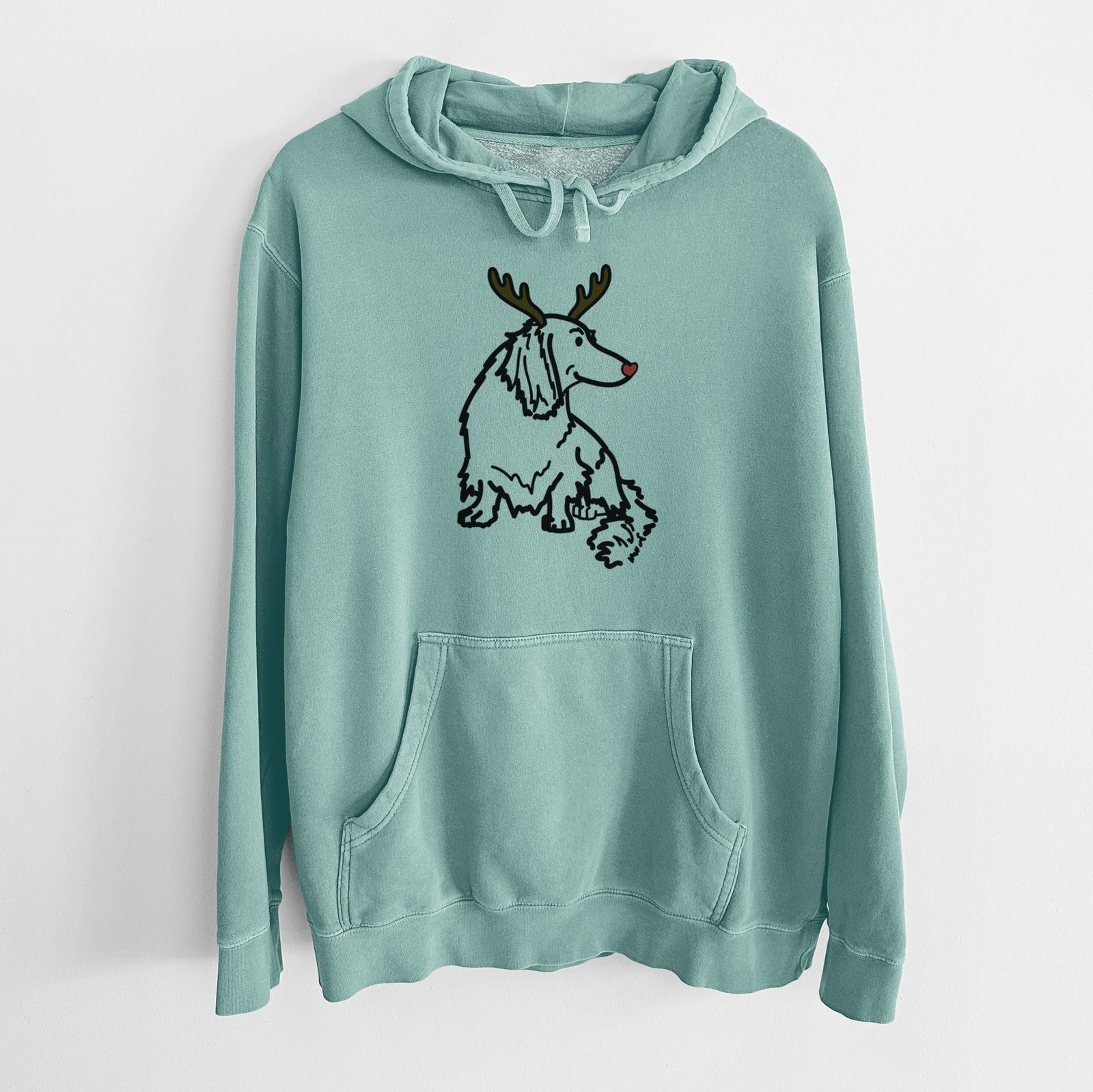Minimalist line drawing of Bella the Dachshund with reindeer antlers and a red nose on a Mint Unisex pigment dyed hoodie