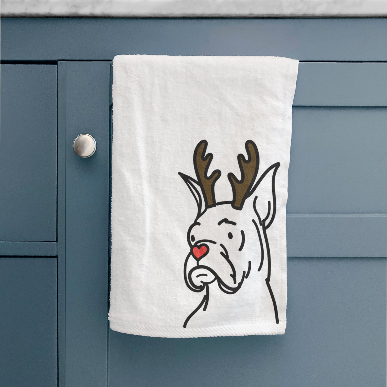Minimalist line drawing of Billy the Rescue Boxer with reindeer antlers and a red nose on a hand towel