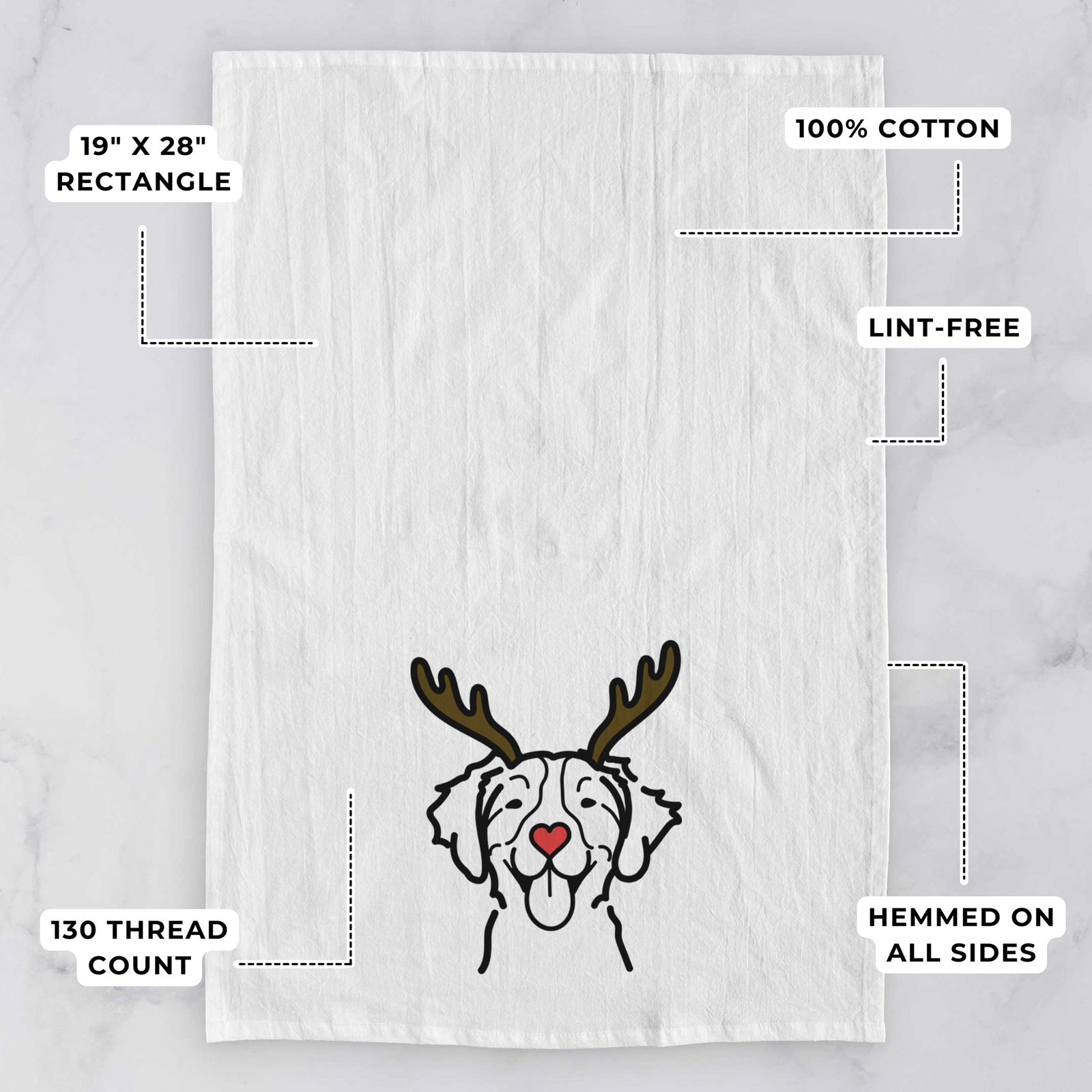 Minimalist line drawing of a Brittany with reindeer antlers and a red nose on a tea towel, with feature callouts: 19 x 28 inch rectangle, 100% cotton, lint-free, 120 thread count, hemmed on all sides