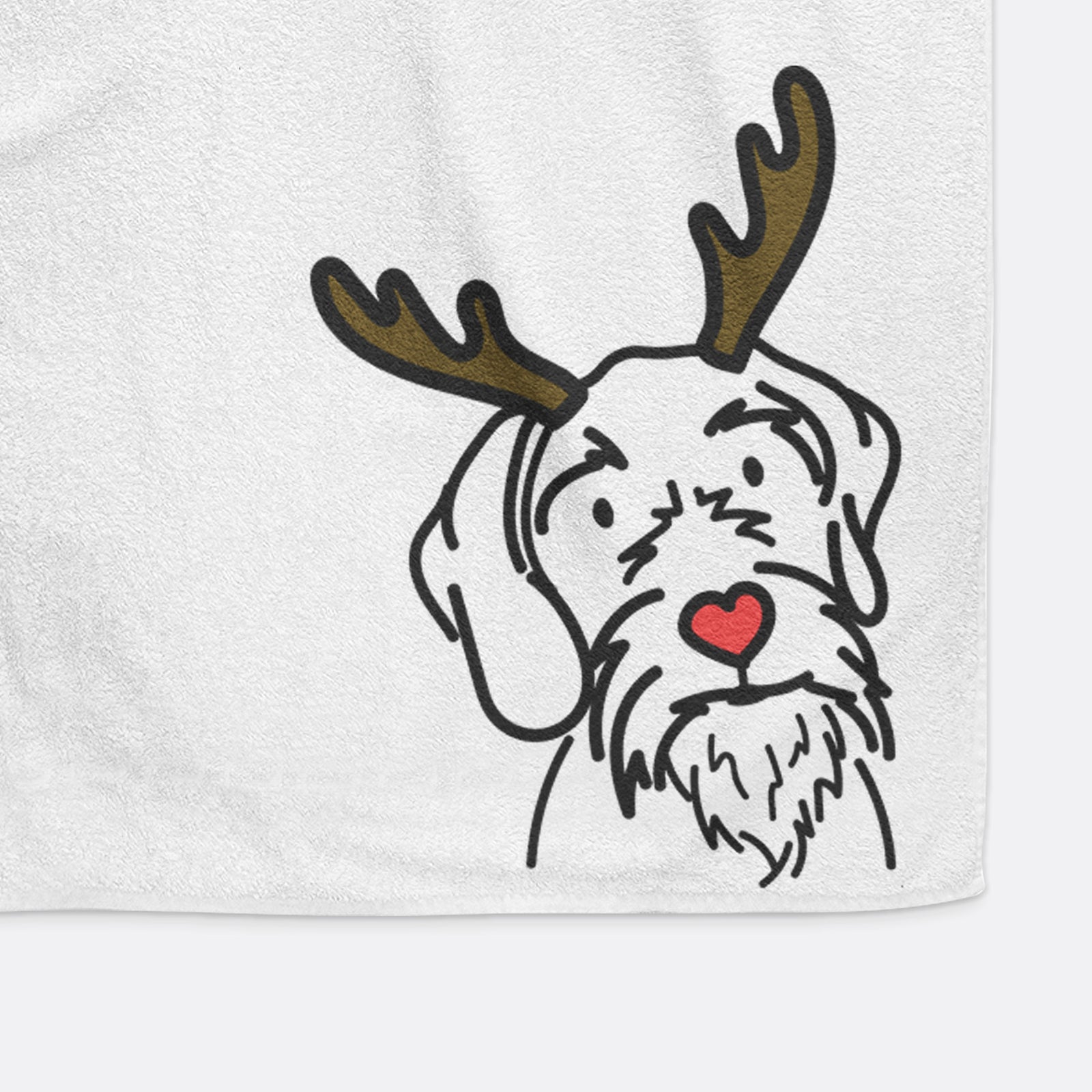Minimalist line drawing of Buck the German Wirehaired Pointer with reindeer antlers and a red nose on a hand towel