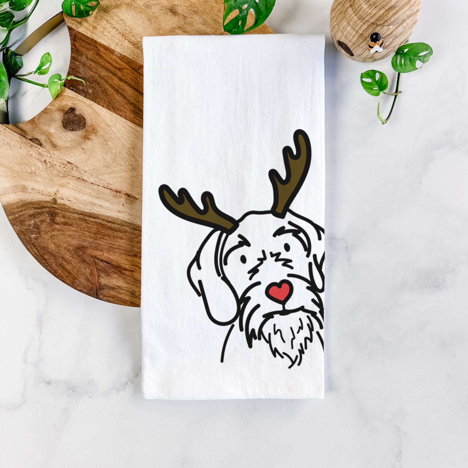 Minimalist line drawing of Buck the German Wirehaired Pointer with reindeer antlers and a red nose on a tea towel
