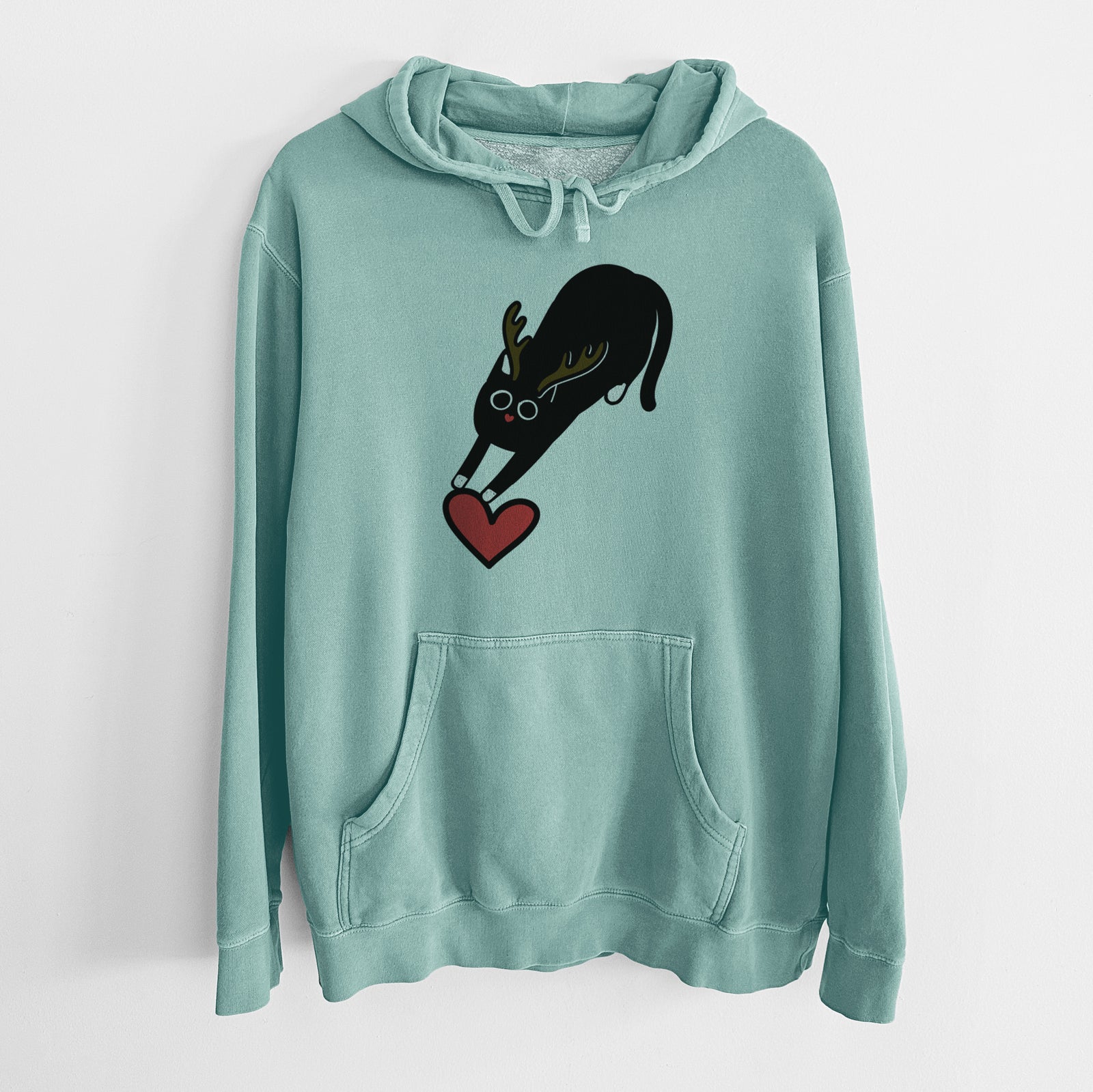 Minimalist line drawing of Bug the Black Cat with reindeer antlers and a red nose on a Mint Unisex pigment dyed hoodie