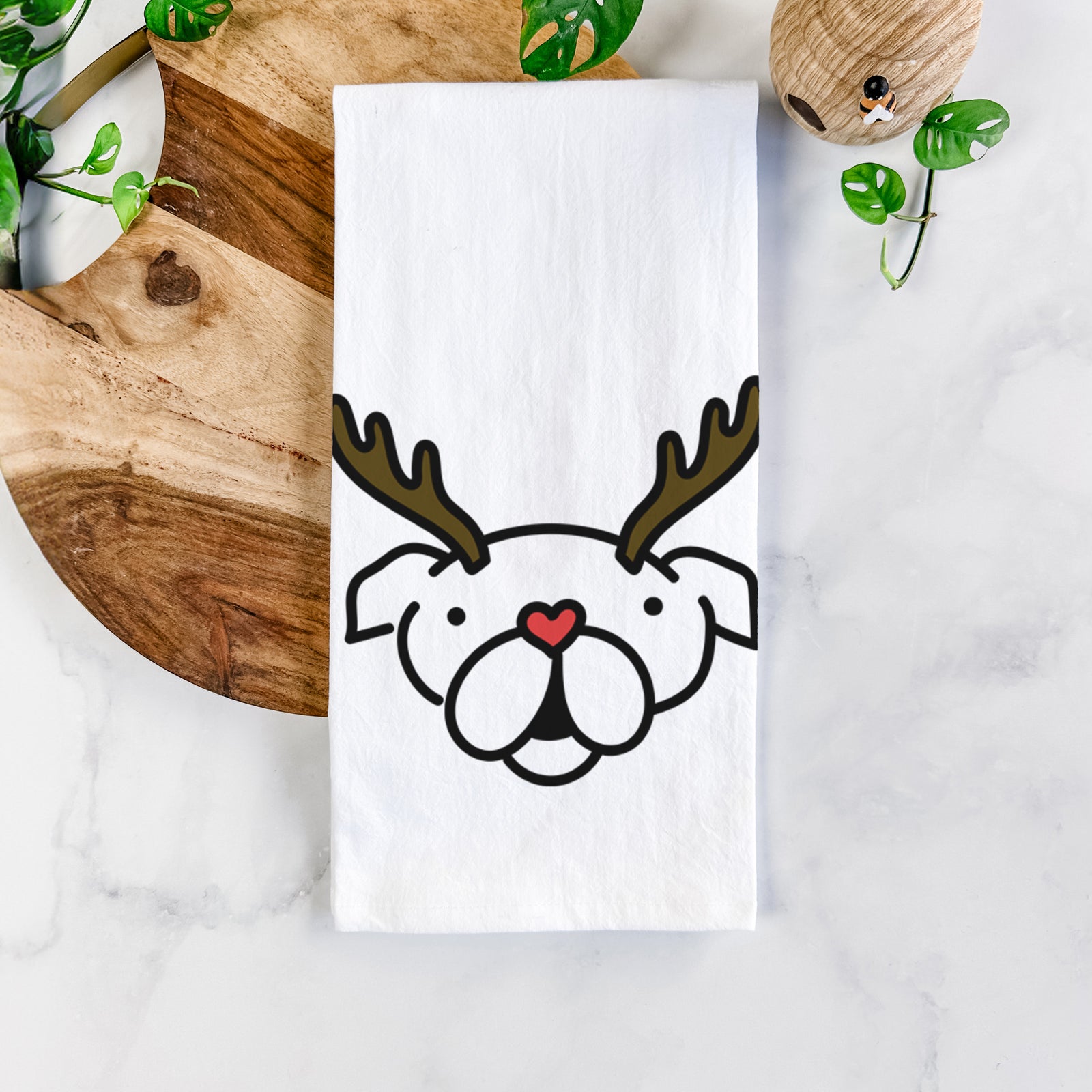Minimalist line drawing of an English Bulldog with reindeer antlers and a red nose on a tea towel