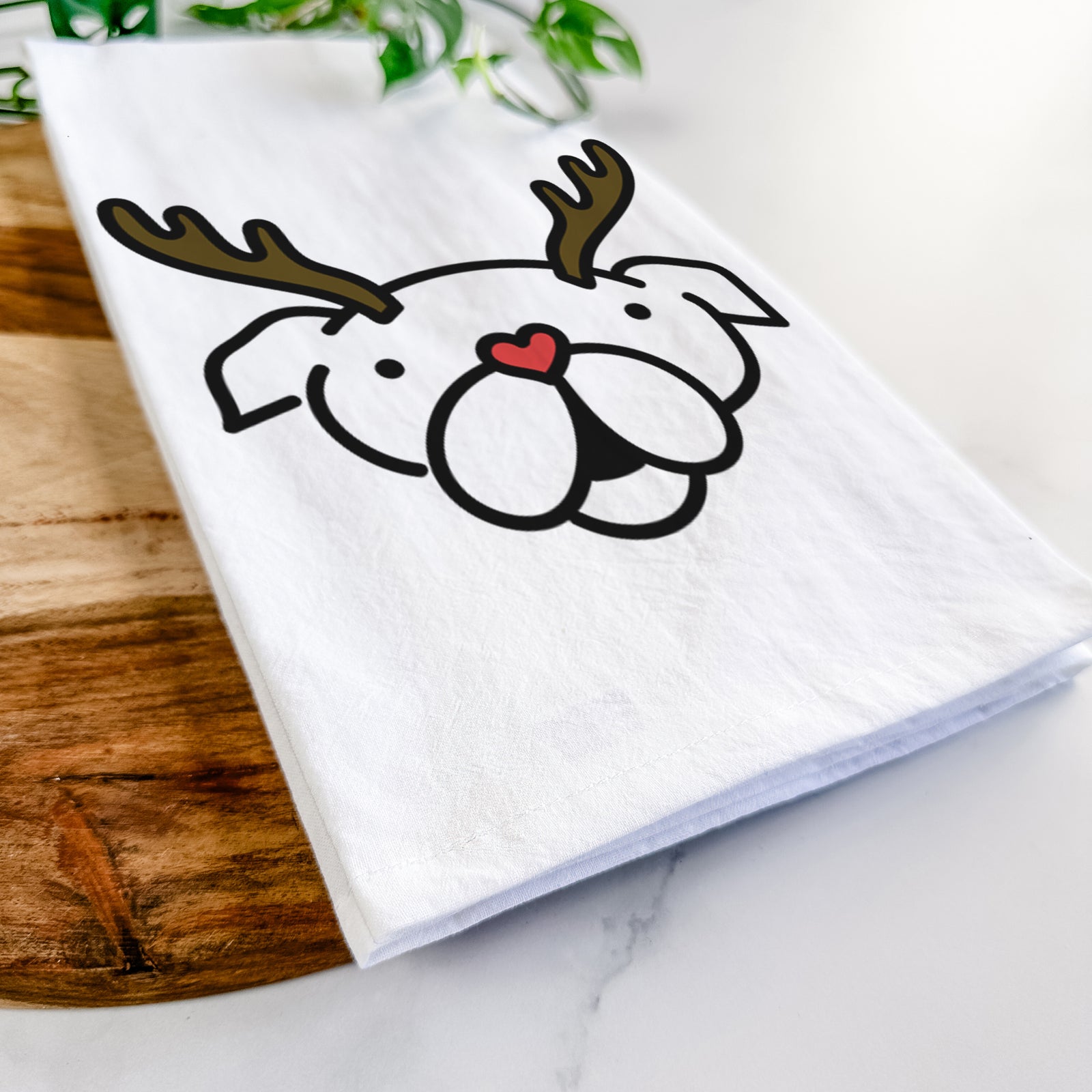 Minimalist line drawing of an English Bulldog with reindeer antlers and a red nose on a tea towel