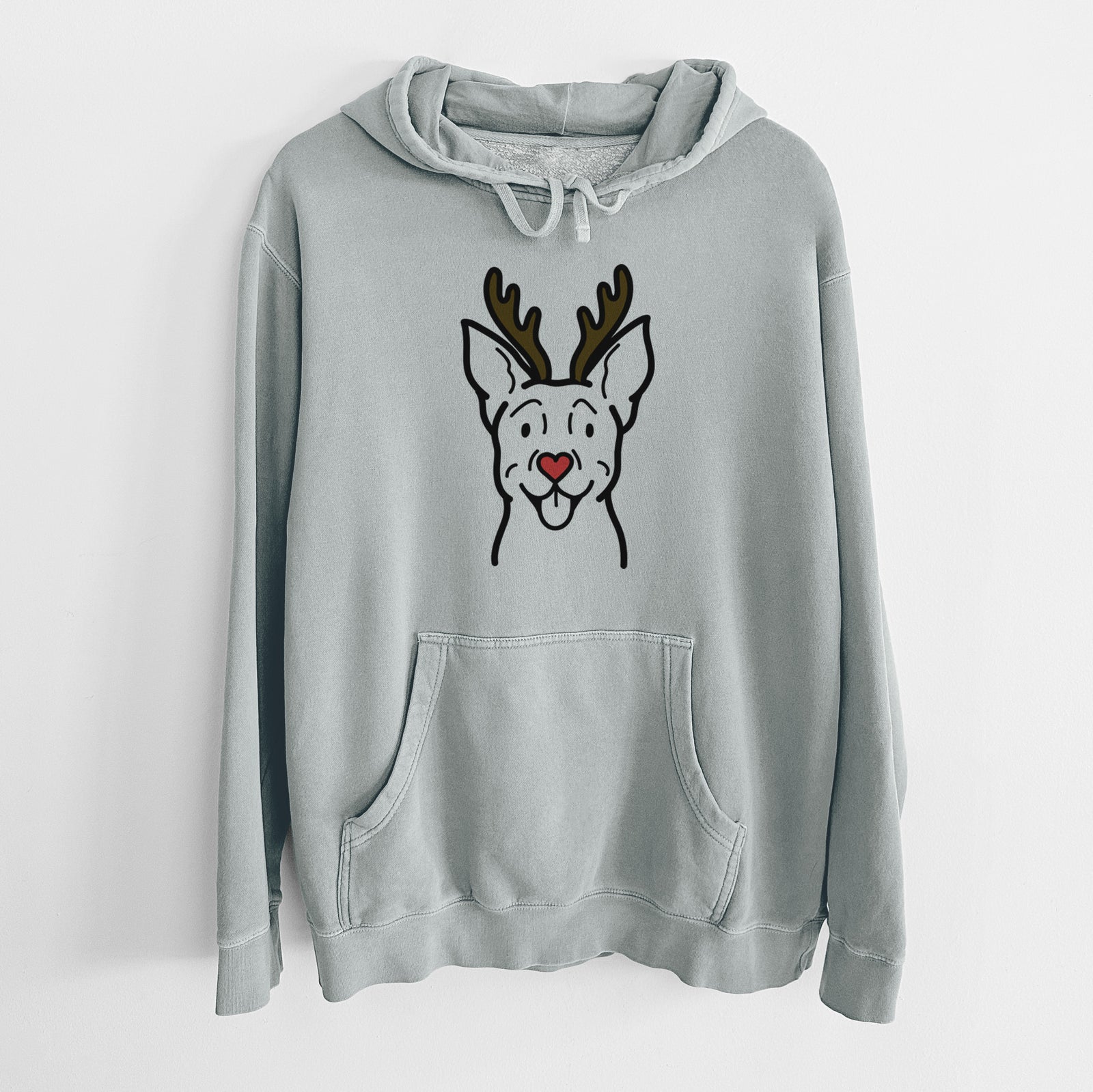 Minimalist line drawing of a Carolina Dog with reindeer antlers and a red nose on a Sage Unisex pigment dyed hoodie