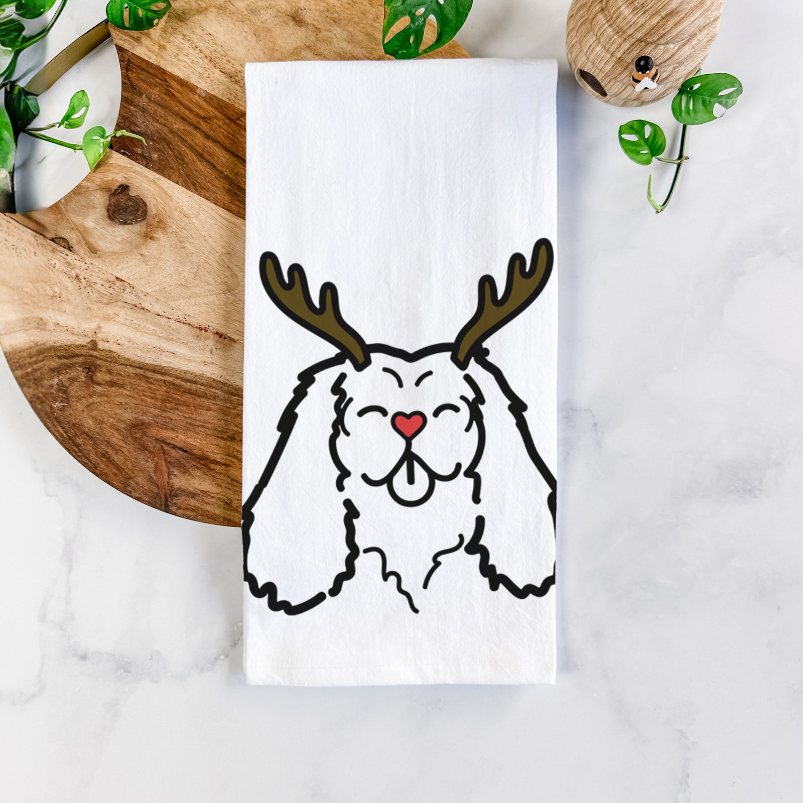 Minimalist line drawing of a Cavalier King Charles Spaniel with reindeer antlers and a red nose on a tea towel