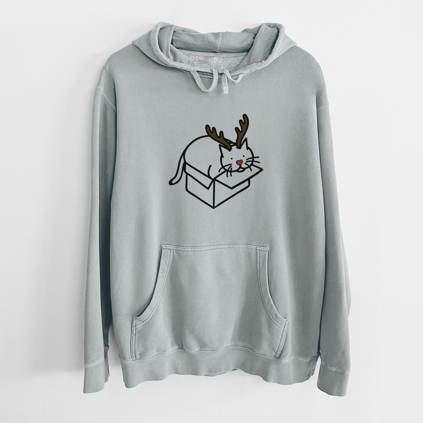 Minimalist line drawing of Charlie the Cat in a Box with reindeer antlers and a red nose on a Sage Unisex pigment dyed hoodie