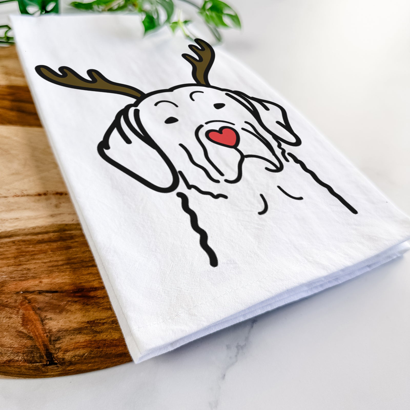 Minimalist line drawing of a Chesapeake Bay Retriever with reindeer antlers and a red nose on a tea towel