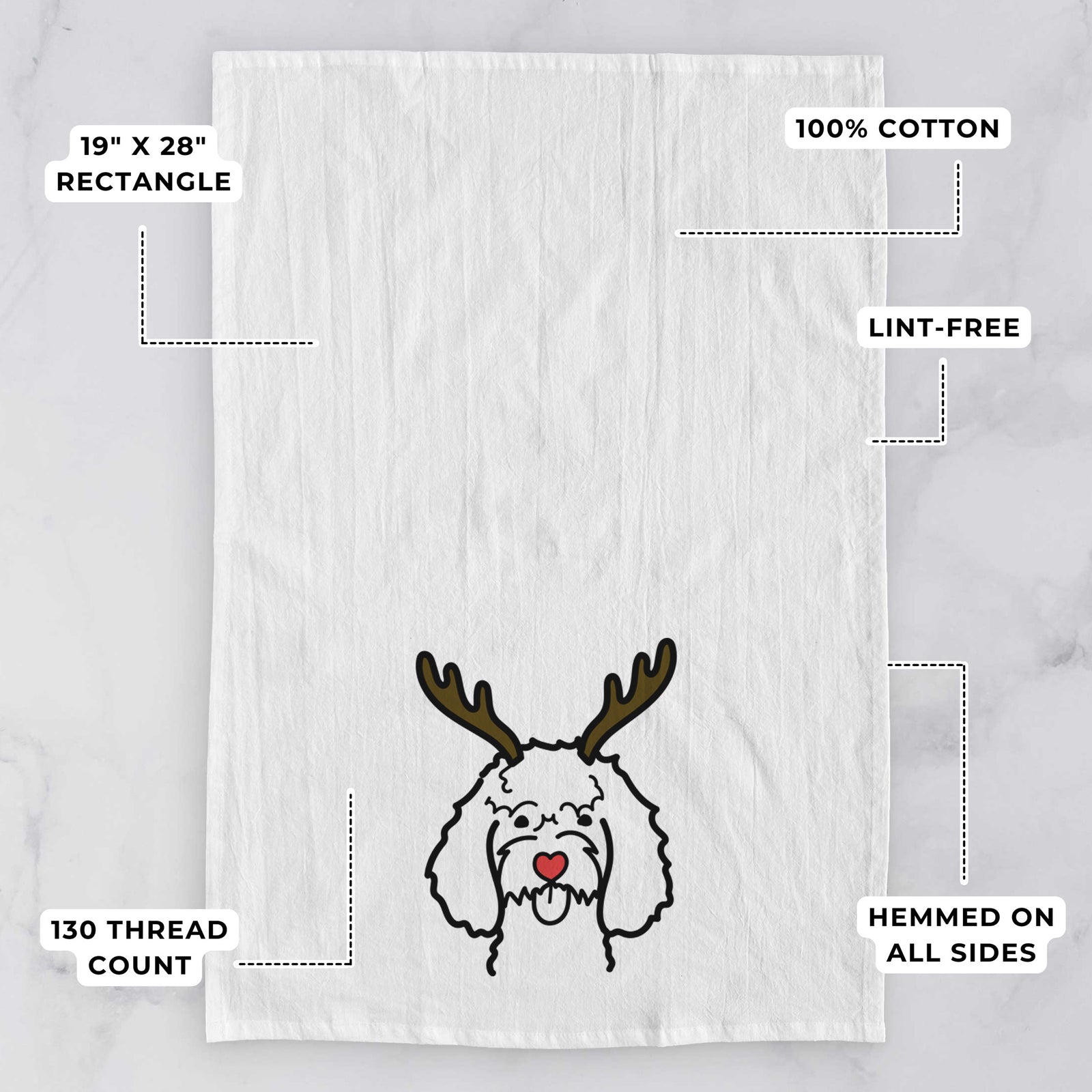 Minimalist line drawing of a Cockapoo with reindeer antlers and a red nose on a tea towel, with feature callouts: 19 x 28 inch rectangle, 100% cotton, lint-free, 120 thread count, hemmed on all sides