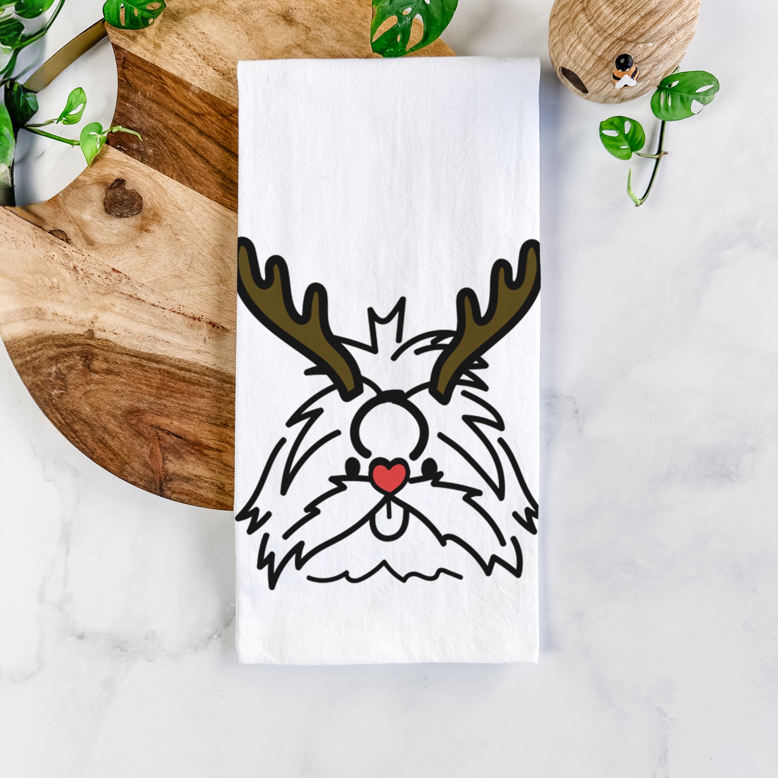 Minimalist line drawing of CoCo the Shih Tzu with reindeer antlers and a red nose on a tea towel