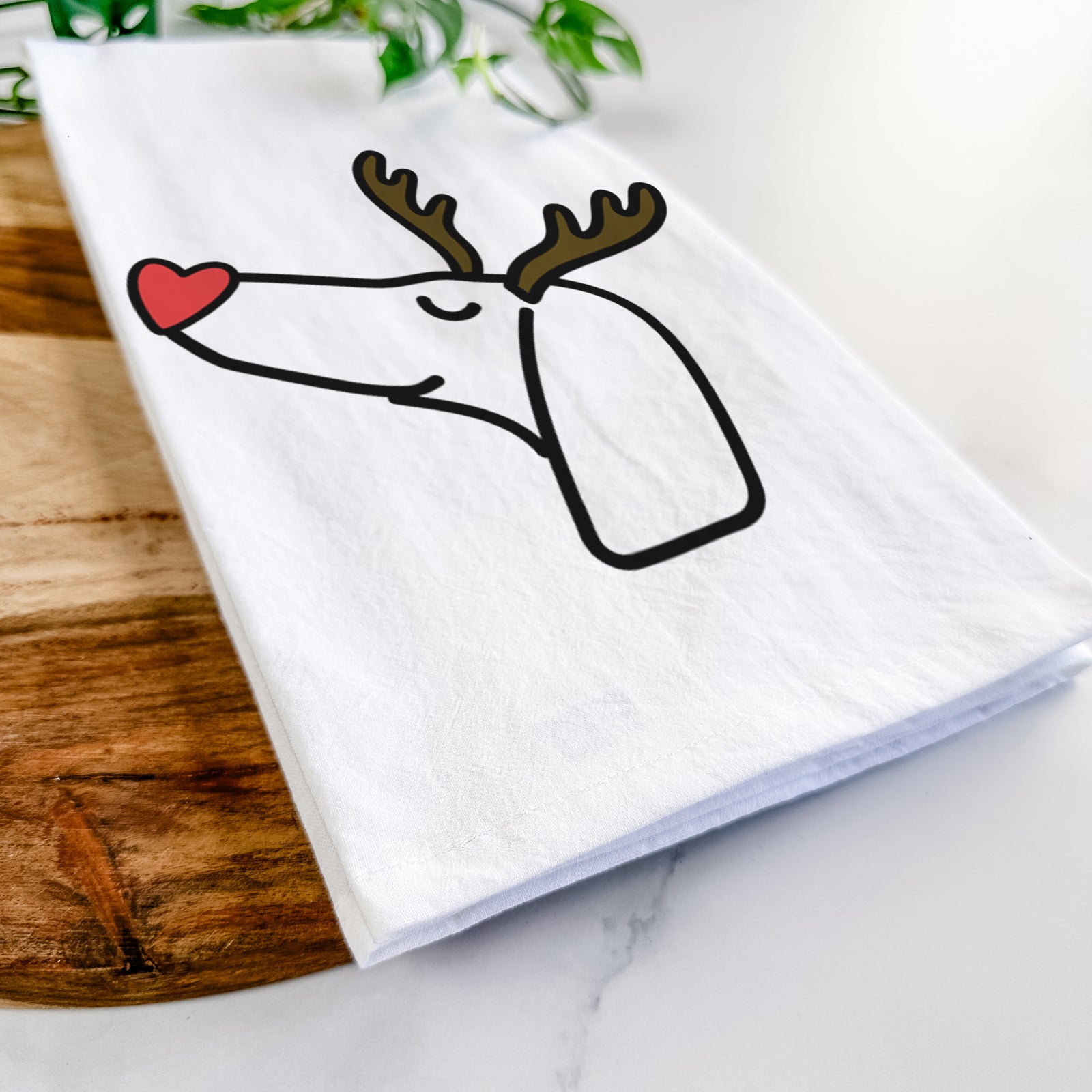 Minimalist line drawing of a Dachshund with reindeer antlers and a red nose on a tea towel