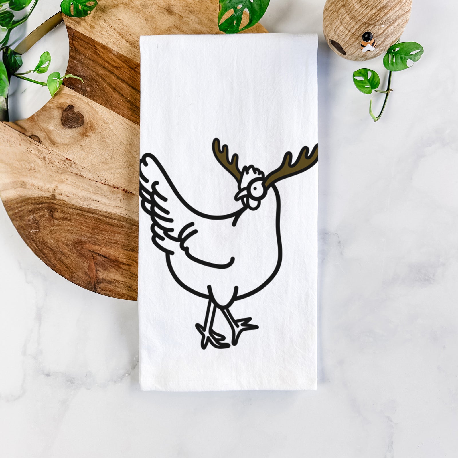 Minimalist line drawing of Daisy the Chicken with reindeer antlers and a red nose on a tea towel