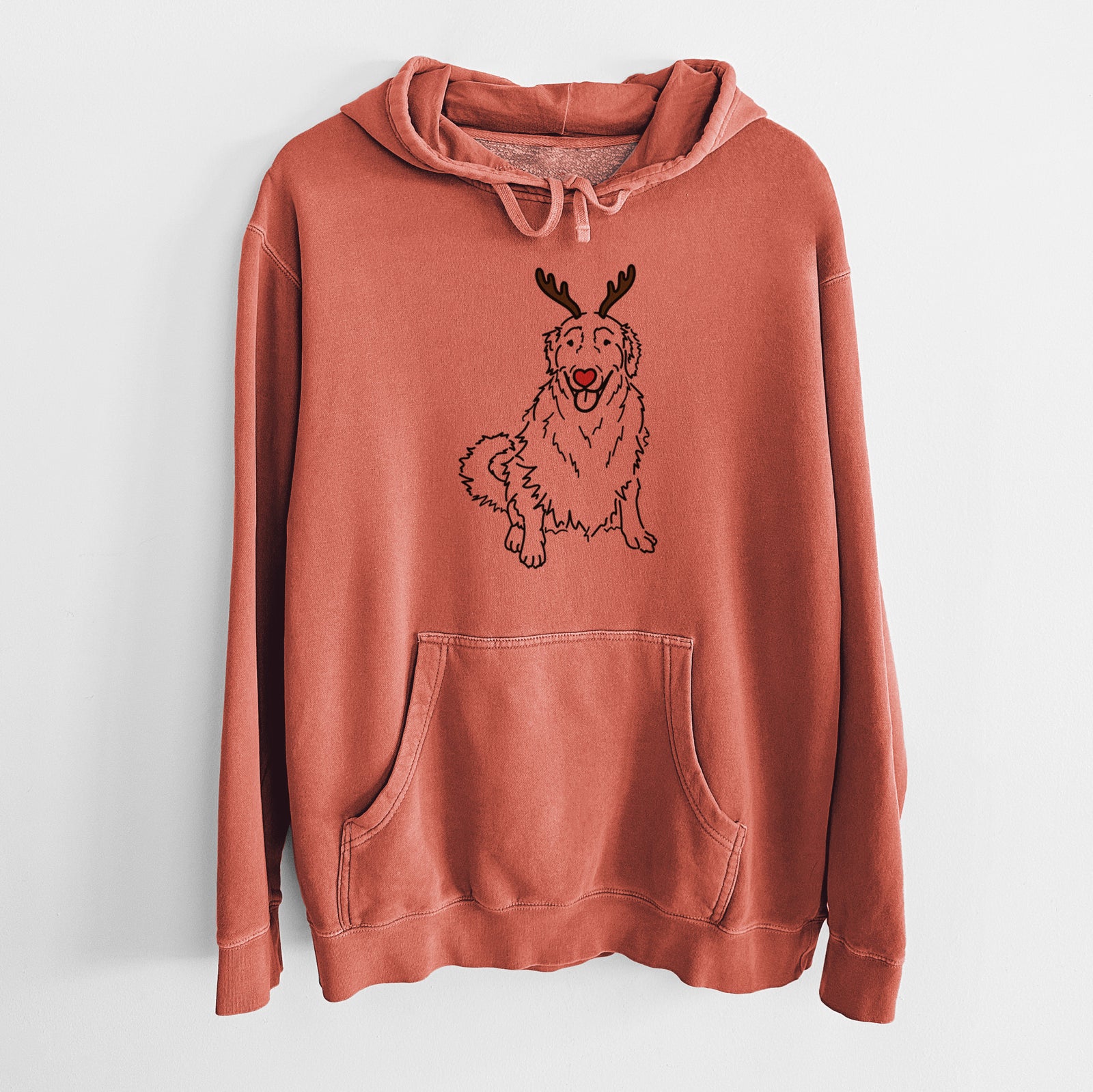 Minimalist line drawing of Daisy the Golden Retriever with reindeer antlers and a red nose on an Amber Unisex pigment dyed hoodie