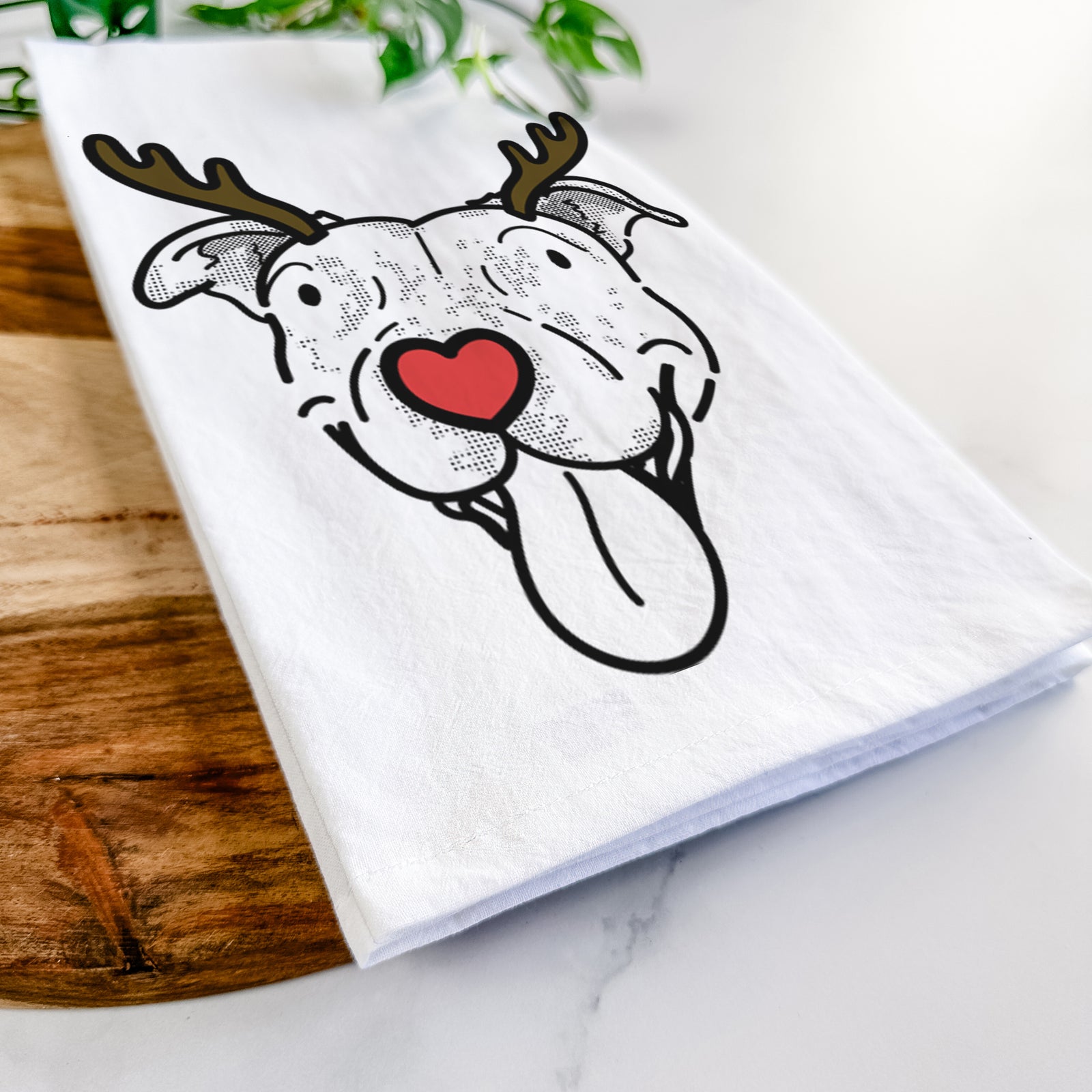 Minimalist line drawing of Dottie the Pitbull Mix with reindeer antlers and a red nose on a tea towel