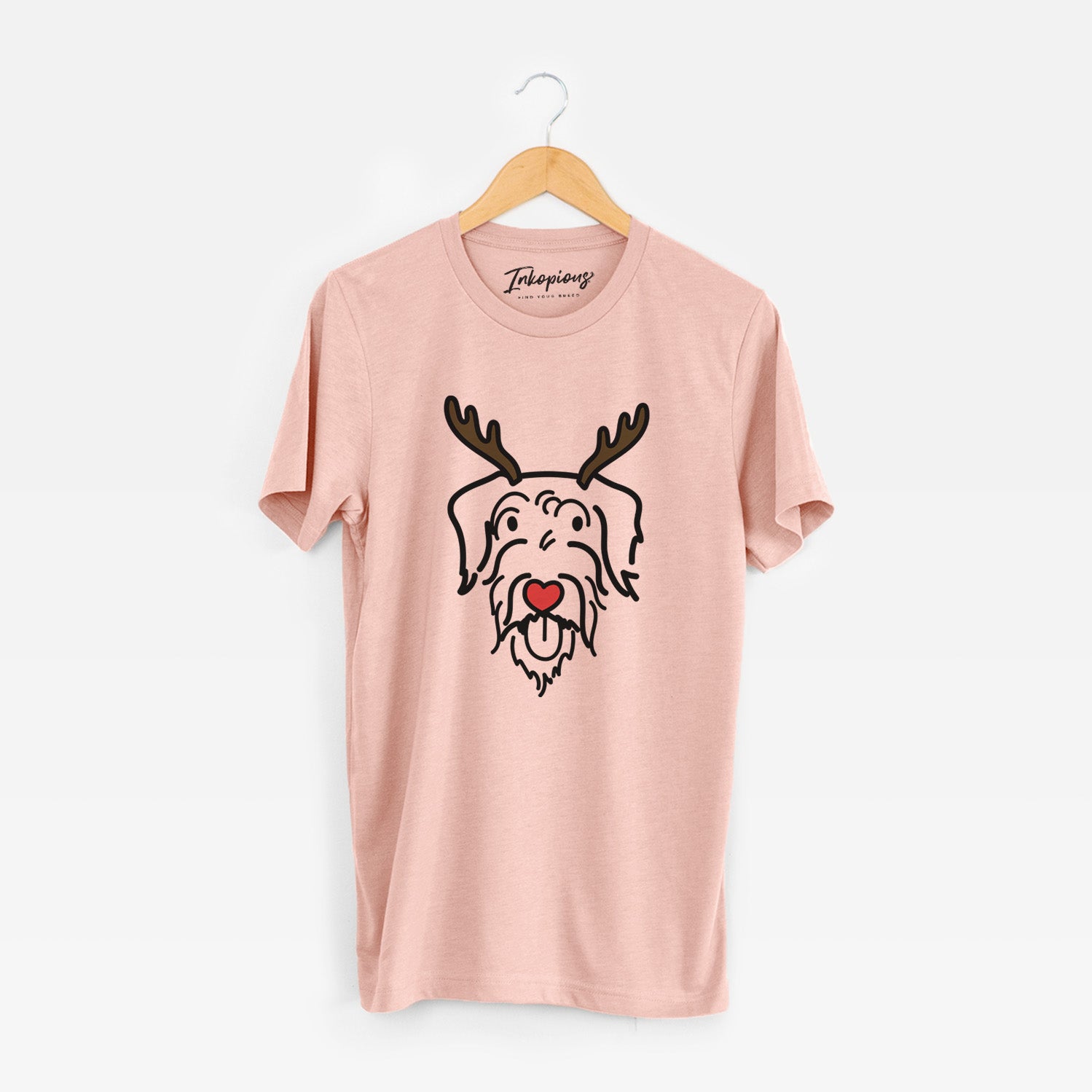 Minimalist line drawing of Dug the Doodle with reindeer antlers and a red nose on a Peach Unisex crewneck