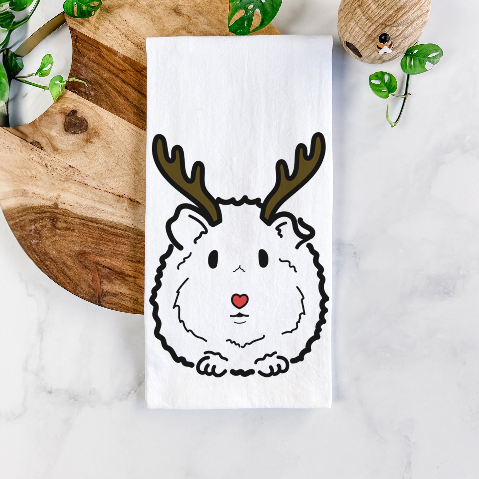 Minimalist line drawing of Duke the Guinea Pig with reindeer antlers and a red nose on a tea towel
