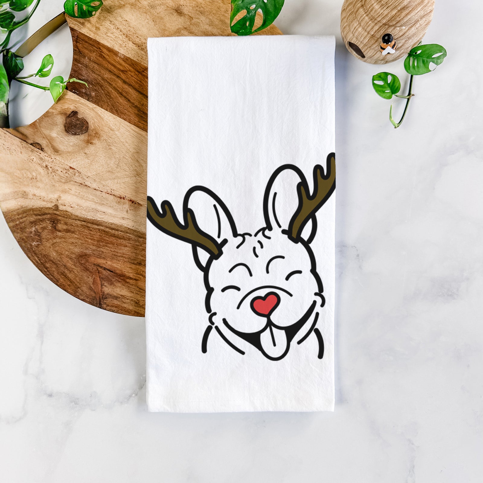 Minimalist line drawing of a French Bulldog with reindeer antlers and a red nose on a tea towel