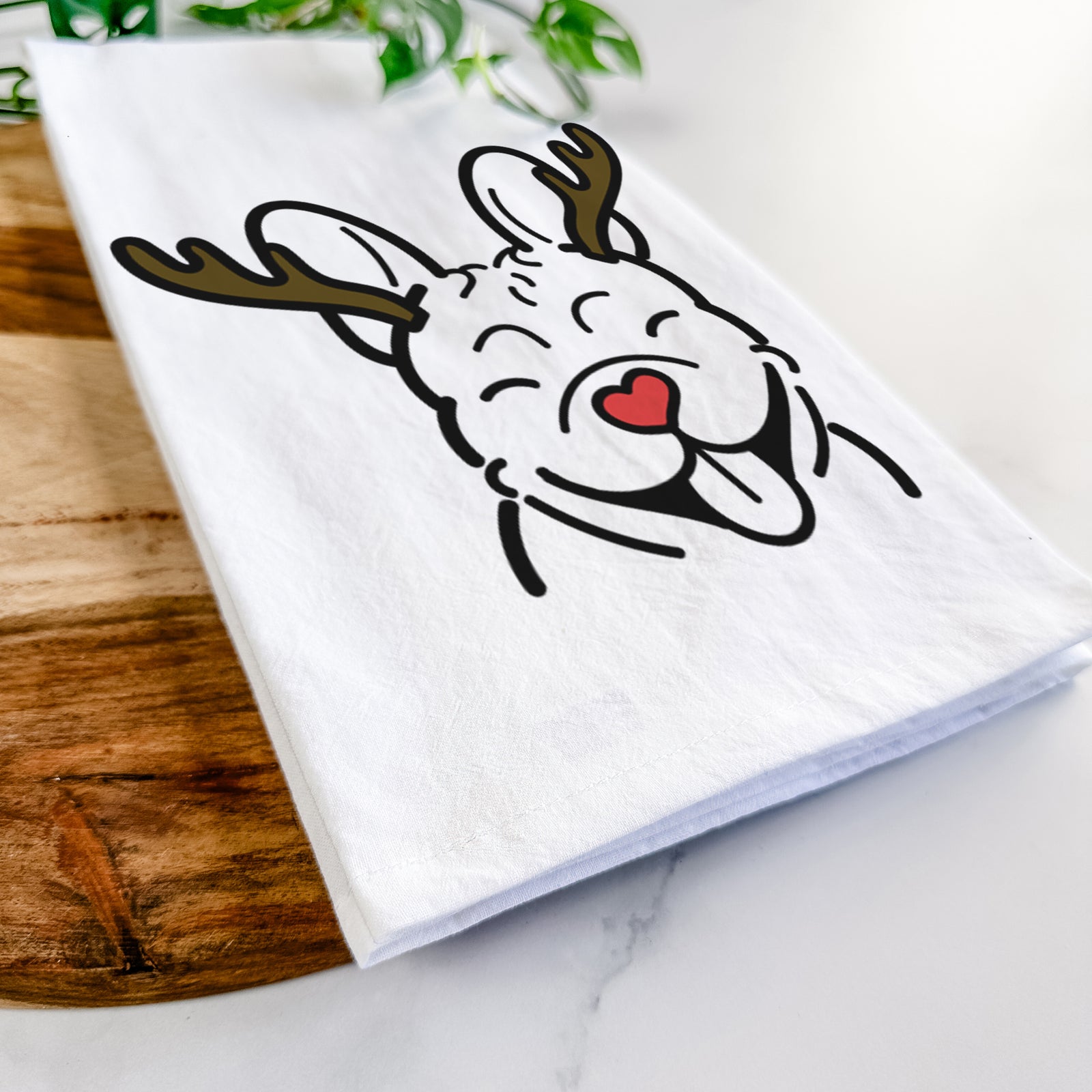 Minimalist line drawing of a French Bulldog with reindeer antlers and a red nose on a tea towel