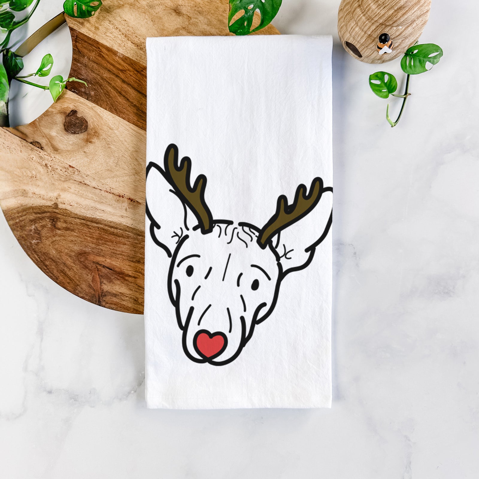 Minimalist line drawing of Georgia the American Hairless Terrier with reindeer antlers and a red nose on a tea towel