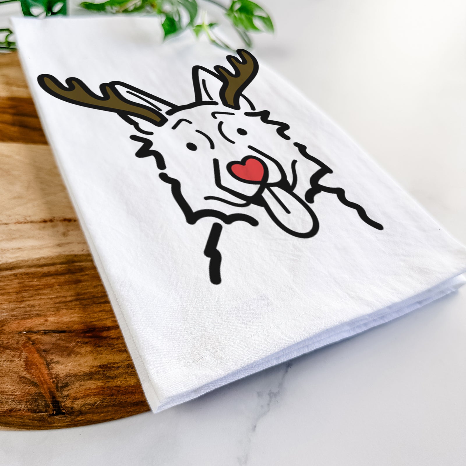 Minimalist line drawing of a German Shepherd with reindeer antlers and a red nose on a tea towel