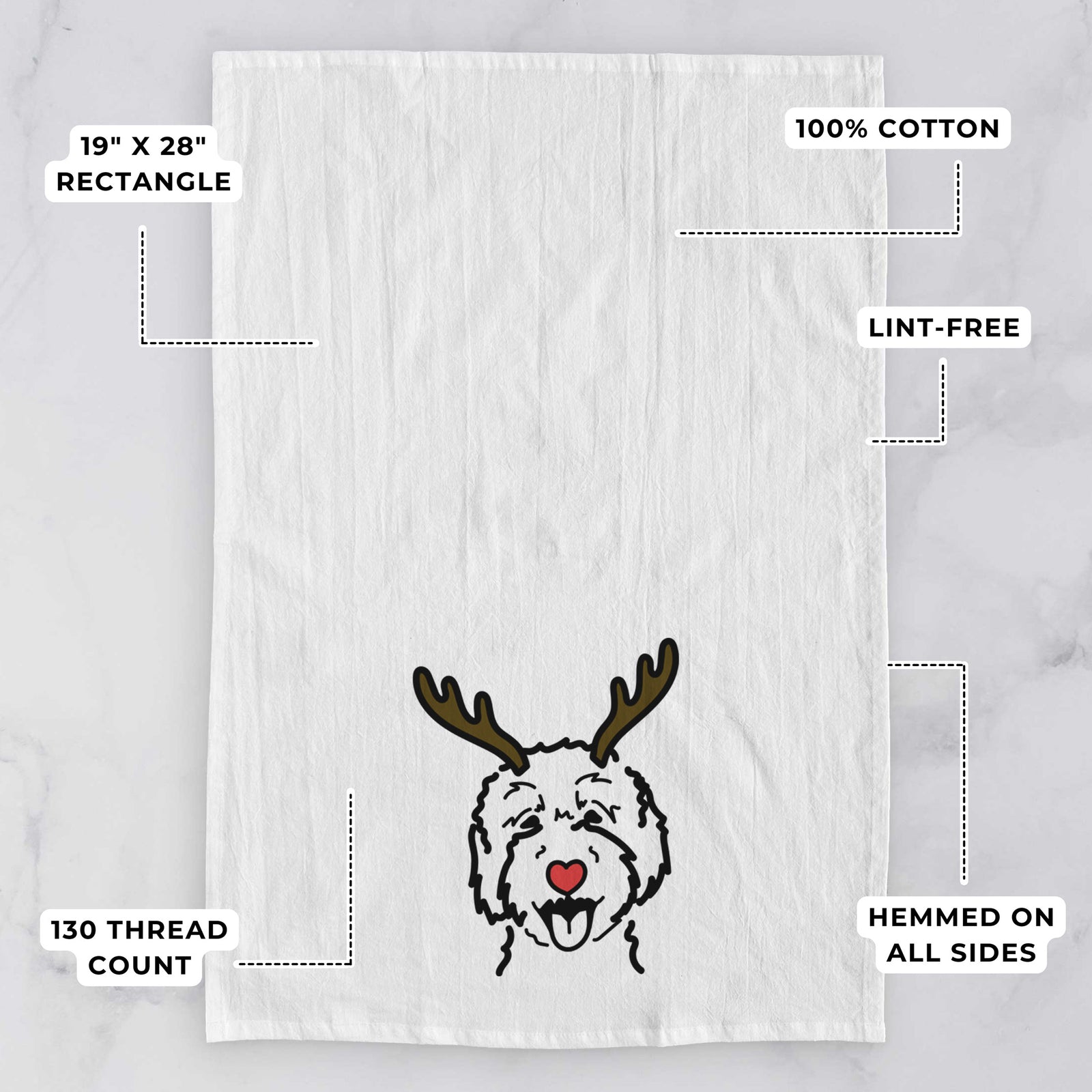 Minimalist line drawing of a Goldendoodle 2 with reindeer antlers and a red nose on a tea towel, with feature callouts: 19 x 28 inch rectangle, 100% cotton, lint-free, 120 thread count, hemmed on all sides