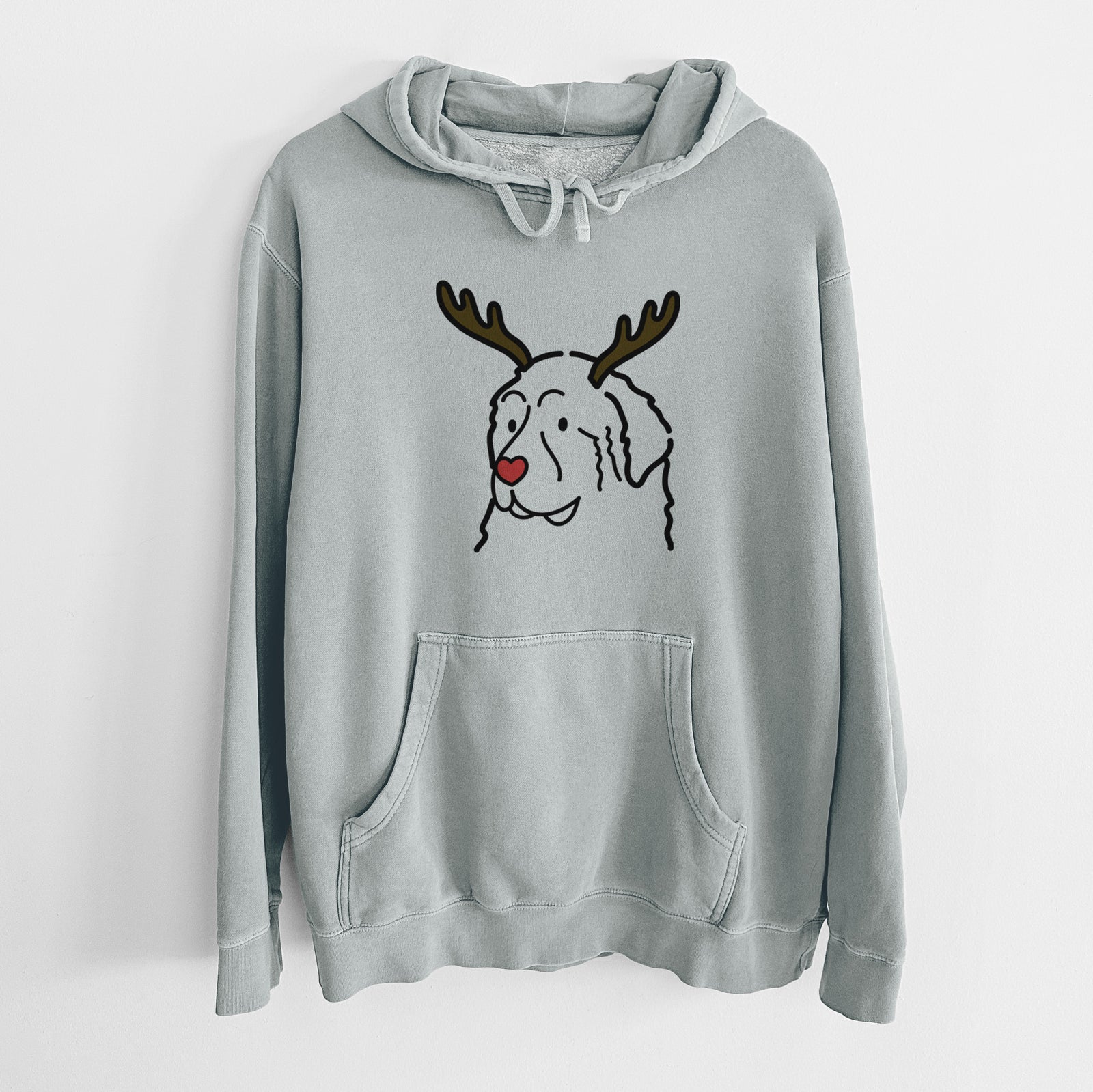 Minimalist line drawing of a Great Pyrenees with reindeer antlers and a red nose on a Sage Unisex pigment dyed hoodie