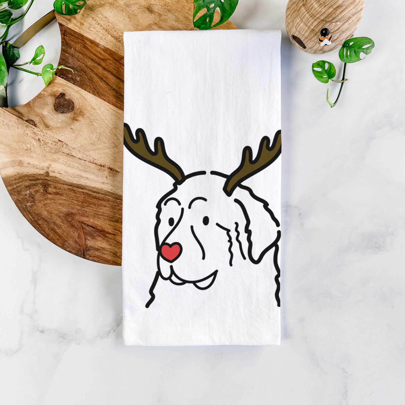 Minimalist line drawing of a Great Pyrenees with reindeer antlers and a red nose on a tea towel