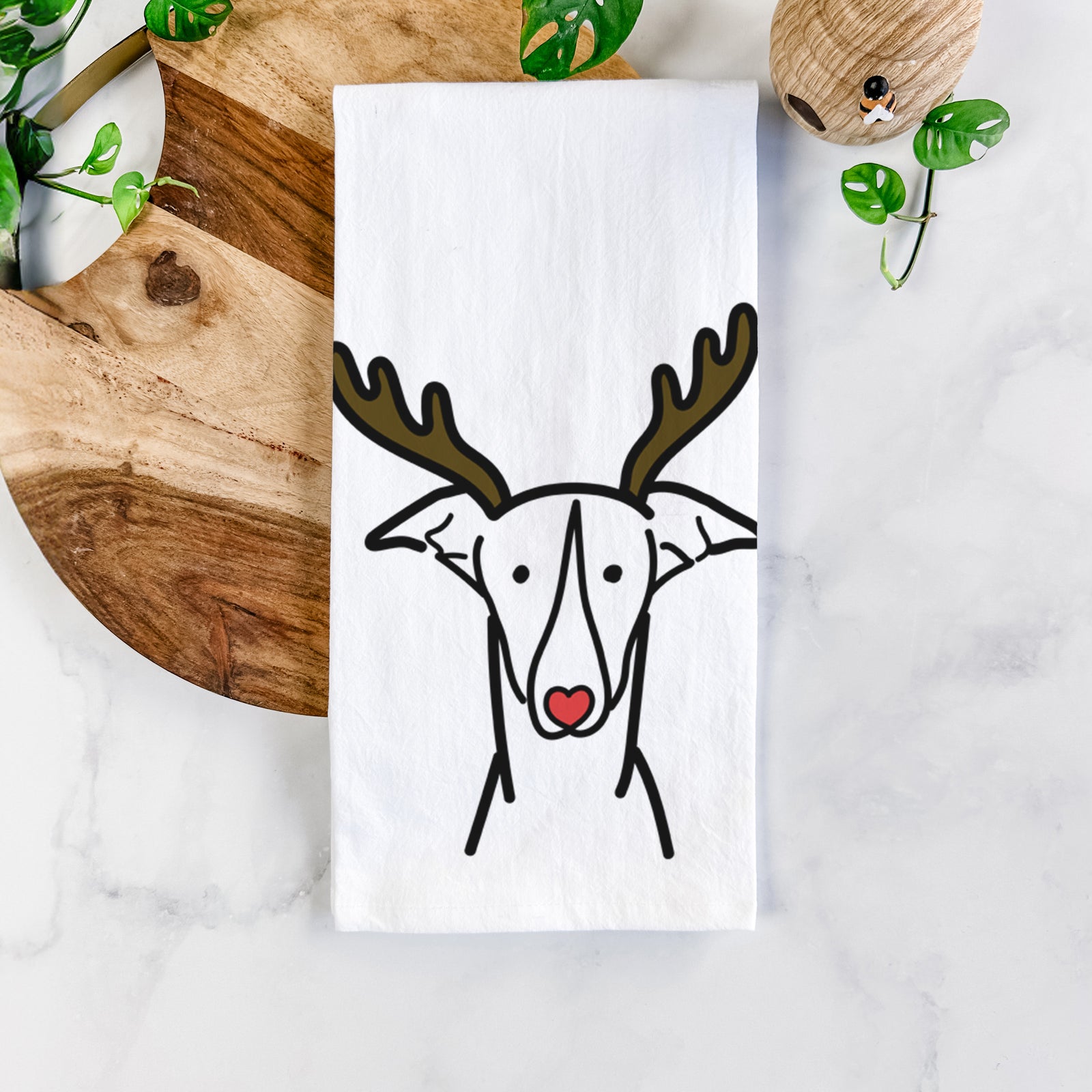 Minimalist line drawing of a Greyhound with reindeer antlers and a red nose on a tea towel