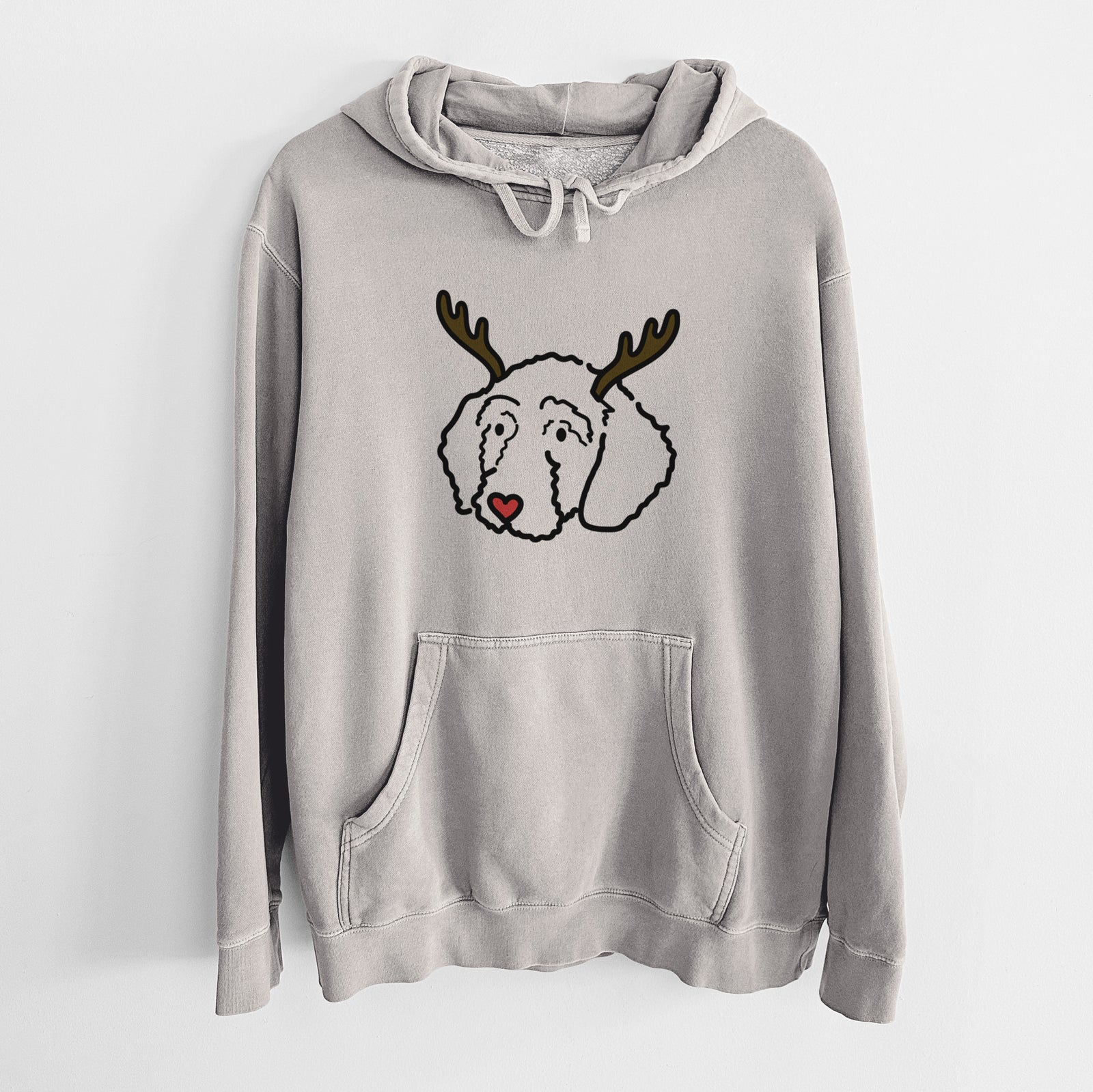 Minimalist line drawing of Hanna the Goldendoodle with reindeer antlers and a red nose on a Cement Unisex pigment dyed hoodie