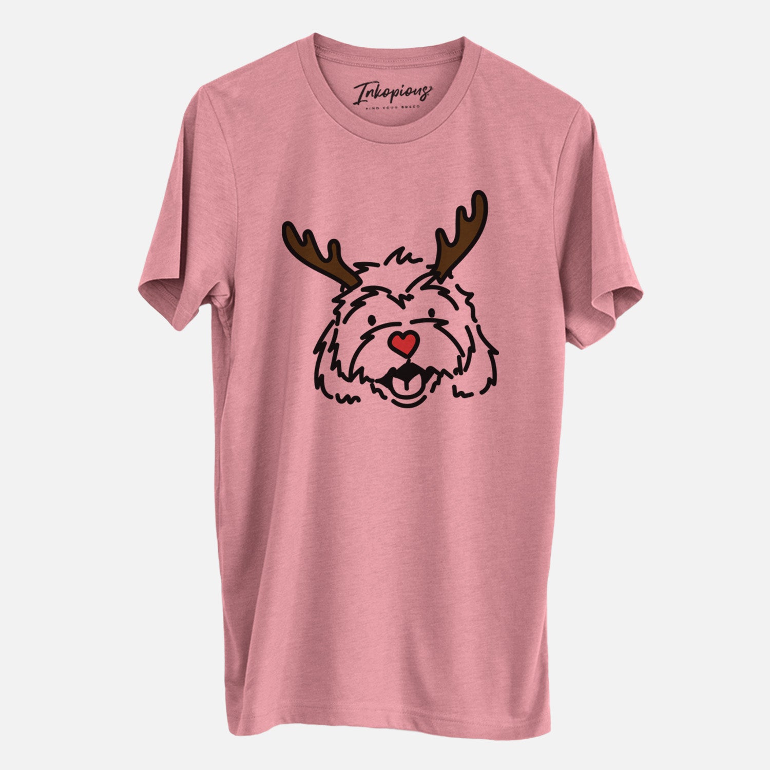 Minimalist line drawing of Harry the Cavachon with reindeer antlers and a red nose on a Mauve Unisex crewneck, worn by a man