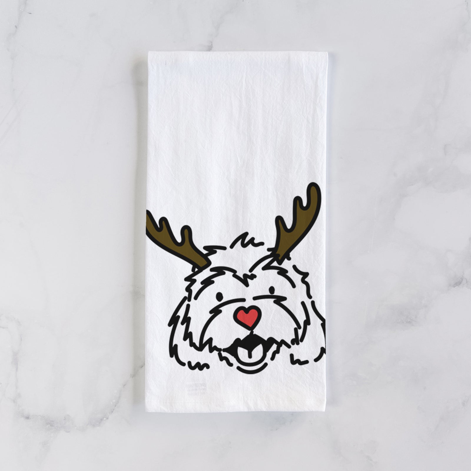 Minimalist line drawing of Harry the Cavachon with reindeer antlers and a red nose on a tea towel
