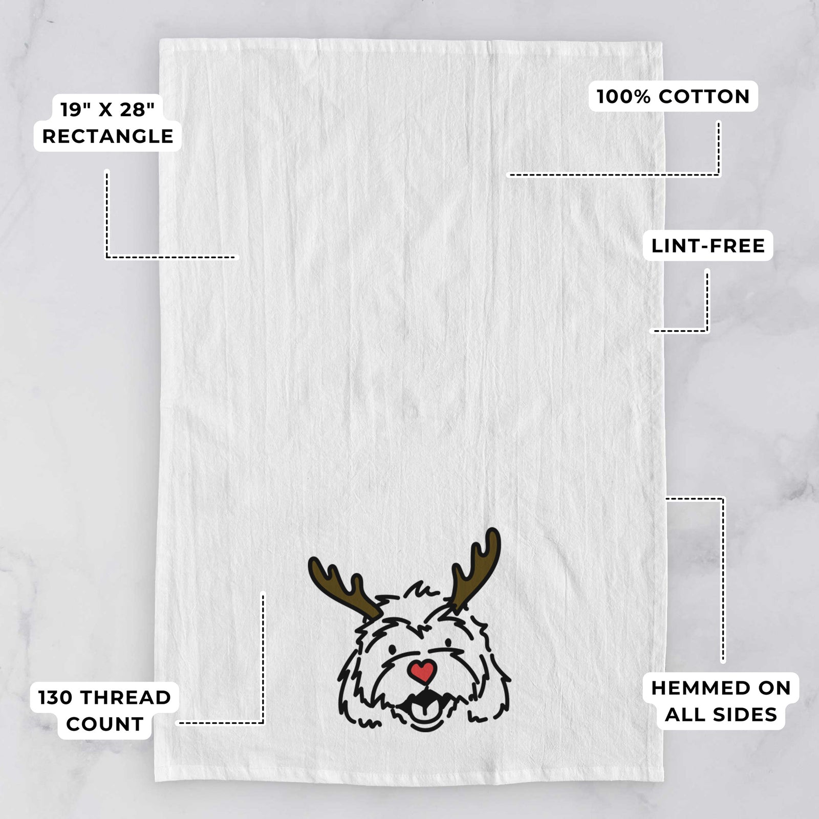 Minimalist line drawing of Harry the Cavachon with reindeer antlers and a red nose on a tea towel, with feature callouts: 19 x 28 inch rectangle, 100% cotton, lint-free, 120 thread count, hemmed on all sides