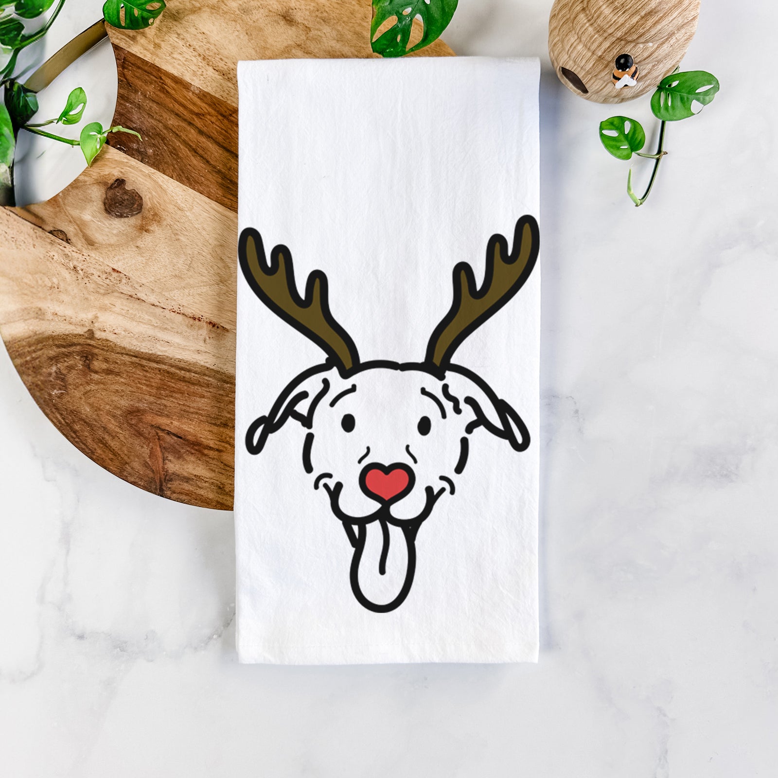 Minimalist line drawing of Hemi the Pitbull Mix with reindeer antlers and a red nose on a tea towel