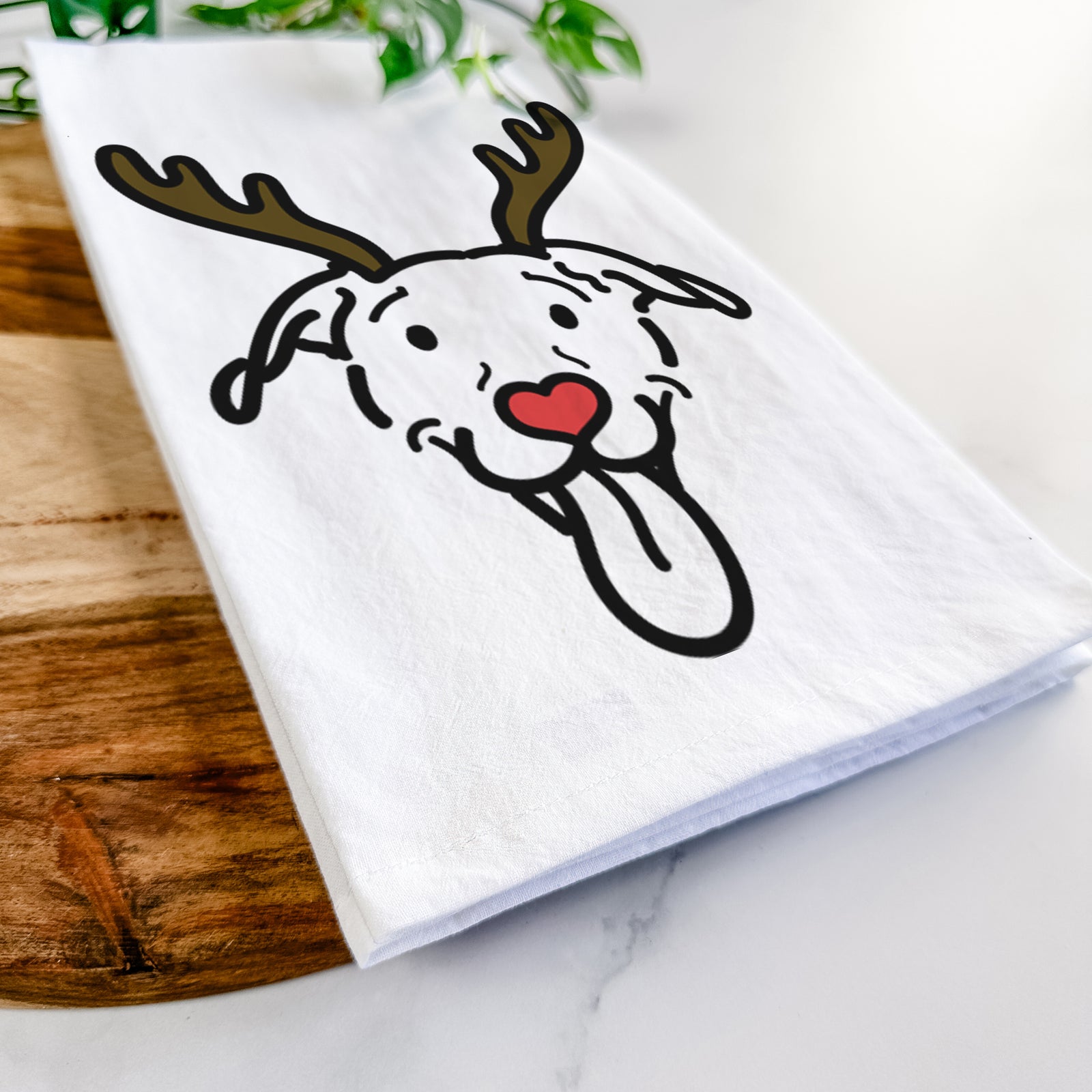 Minimalist line drawing of Hemi the Pitbull Mix with reindeer antlers and a red nose on a tea towel