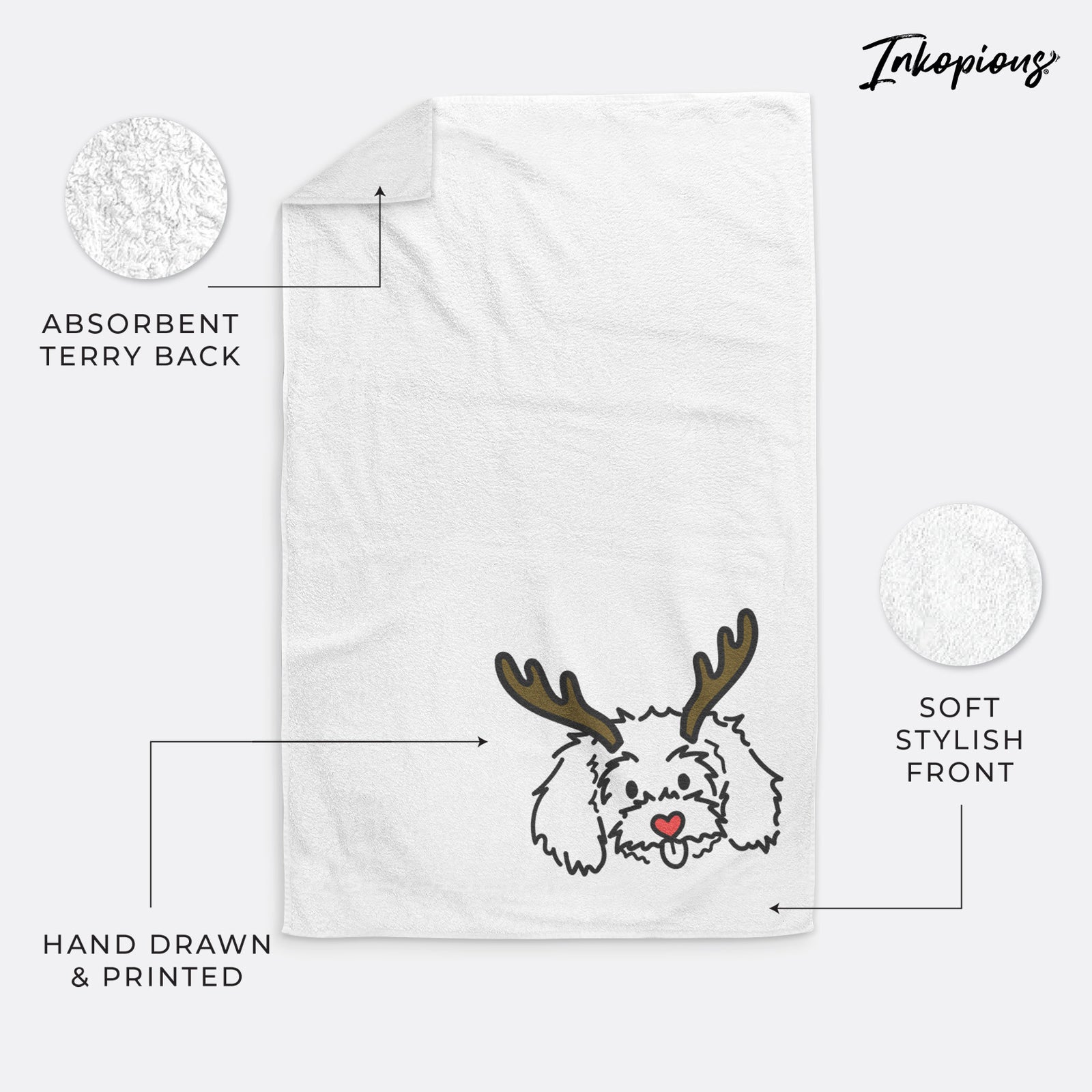 Minimalist line drawing of Holly the Maltipoo with reindeer antlers and a red nose on a decorative hand towel